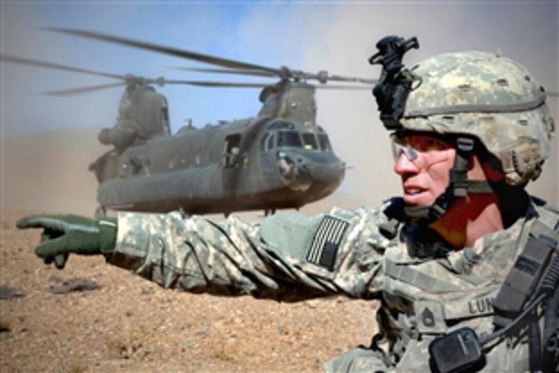 U.S. Army Sgt. 1st Class Scott Lund conducts accountability of soldiers before boarding a CH-47 Chinook helicopter in Logar province, Afghanistan, Oct. 12, 2009. Lund is assigned to the 10th Mountain Division's Company A, Brigade Support Troops Battalion. 