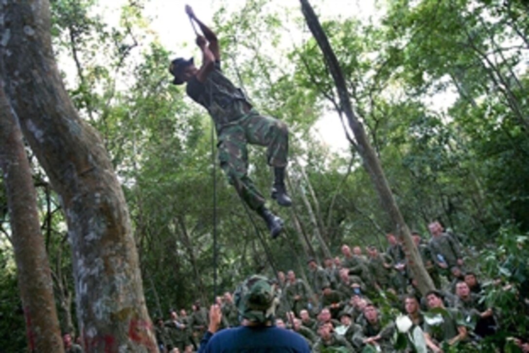 Indonesian marines teach U.S. Marines how to set booby traps during jungle survival training in Selogiri, Indonesia, Oct. 21, 2009. The Marines, assigned to Battalion Landing Team 2nd Battalion, 4th Marine Regiment, 11th Marine Expeditionary Unit, are in Indonesia for an exercise on medical and dental assistance, engineering projects and military interaction.