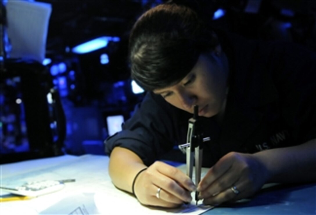 U.S. Navy Seaman Christina Banegas navigates the position of the 7th Fleet command ship USS Blue Ridge (LCC 19) on a chart in ship's combat information center while underway in the Pacific Ocean on Oct. 19, 2009.  The Blue Ridge serves under Commander, Expeditionary Strike Group 7/Task Force 76, the Navy's only forward-deployed amphibious force, and is the flagship of Commander, U.S. 7th Fleet.  