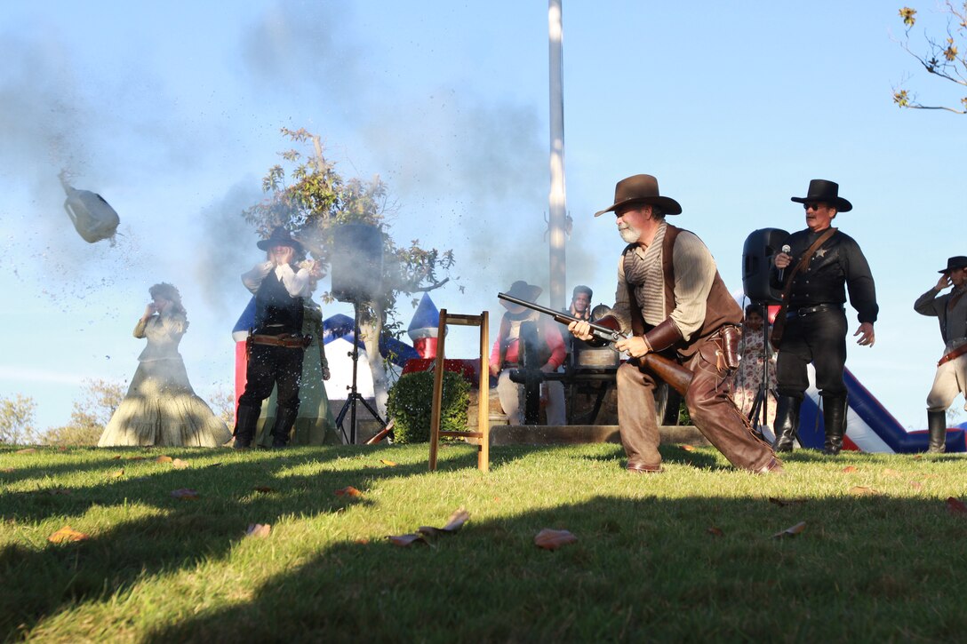 Old Town Temecula Gunfighters put on a show for Marines, sailors and family members of Headquarters and Support Battalion, Marine Corps Base Camp Pendleton, at the Santa Margarita Ranch House, Oct. 23. The unit held a family day fall festival that had lots of food and activities for all ages.