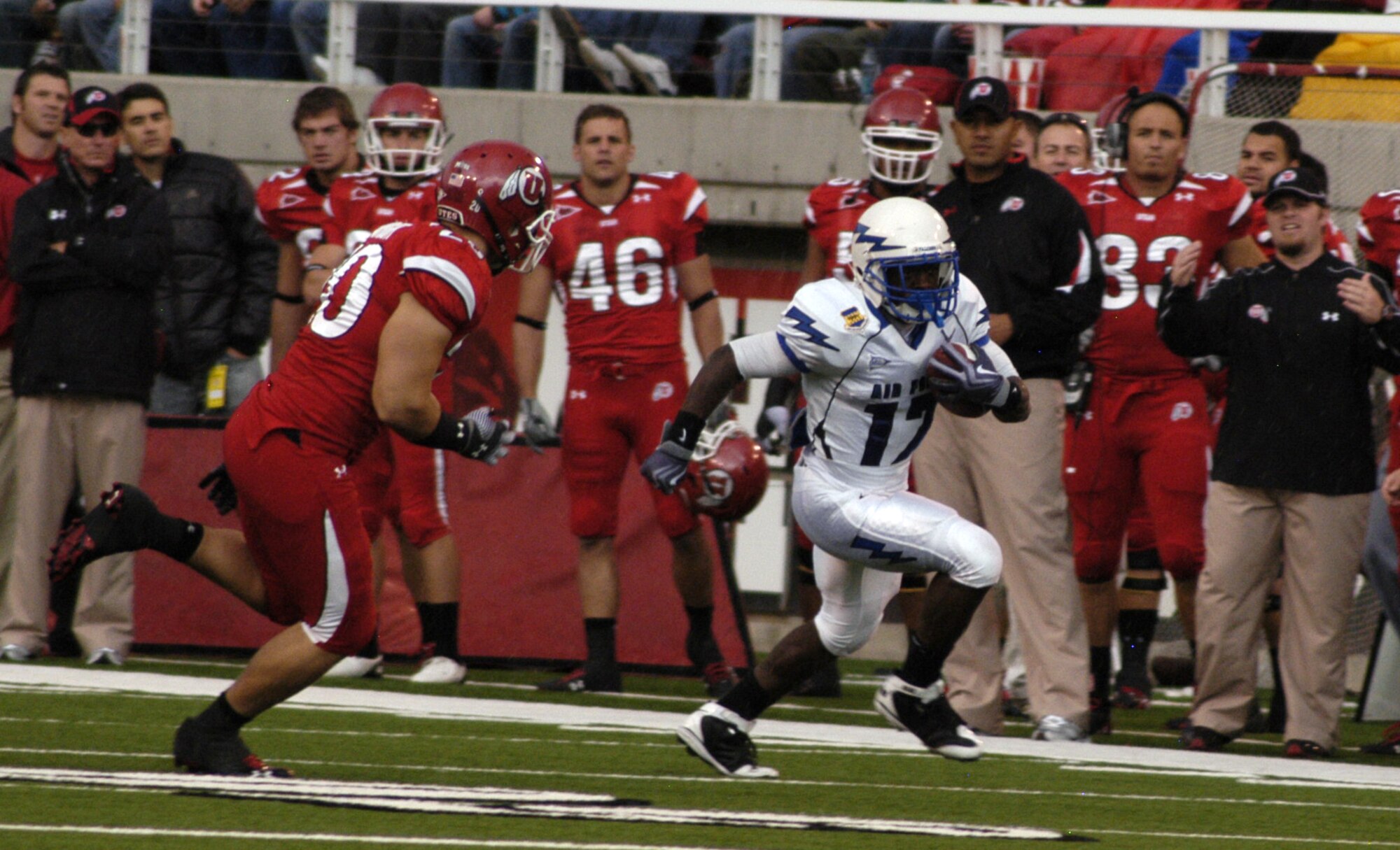 Falcons tailback Asher Clark turns the corner for a gain on Utes linebacker Mike Wright and races along the Utah sideline for a 9-yard gain during the Air Force-Utah game in Salt Lake City Oct. 24, 2009. Clark had 33 yards on 17 carries in Air Force's 23-16 loss to Utah in overtime.