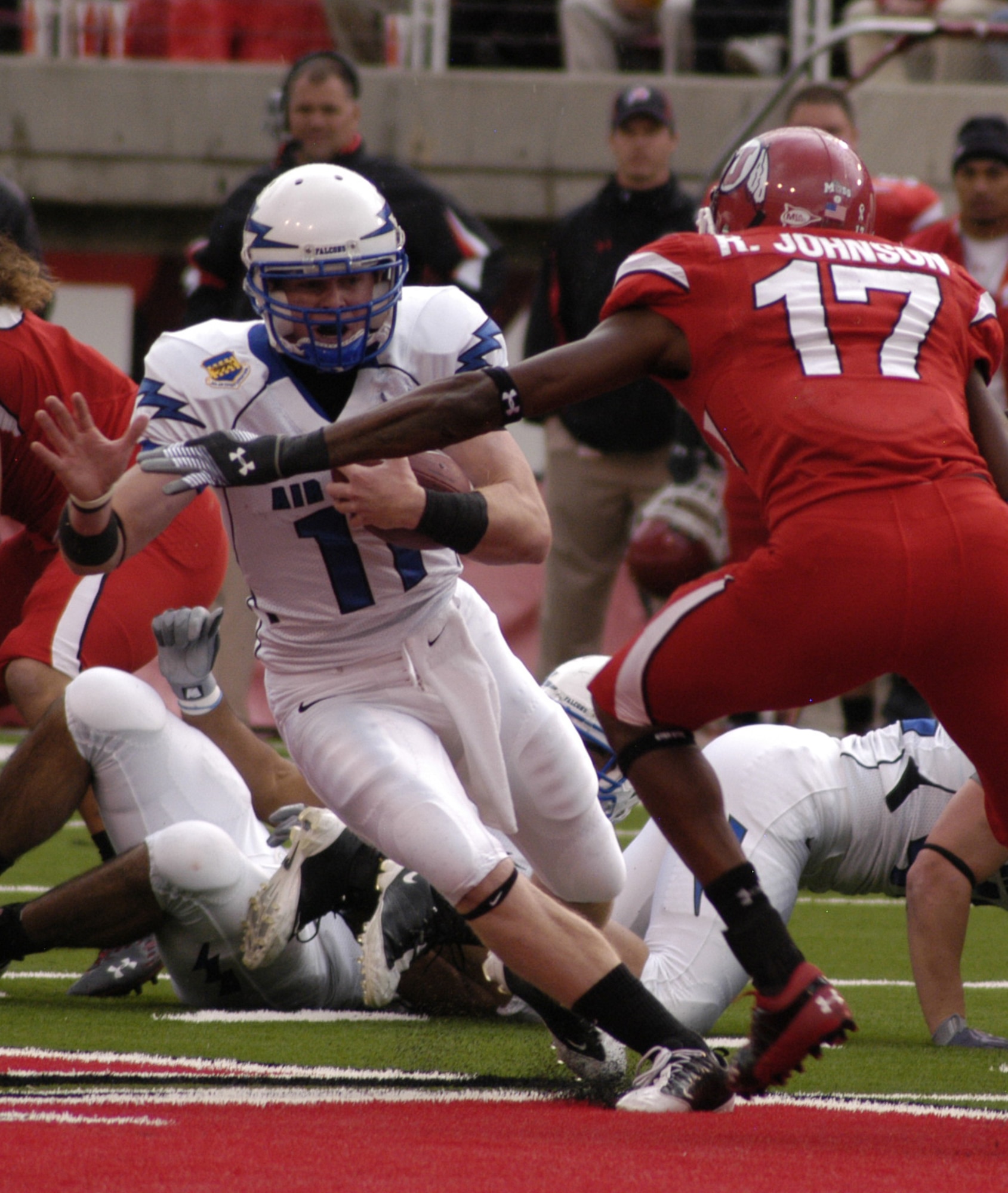 Falcons quarterback Connor Dietz works to elude Utah free safety Robert Johnson during the Air Force-Utah game in Salt Lake City Oct. 24, 2009. Dietz, a sophomore, started at quarterback for the Falcons, completing 7 of 10 passes for 64 yards and rushing 28 times for 98 yards. (U.S. Air Force photo/John Van Winkle)