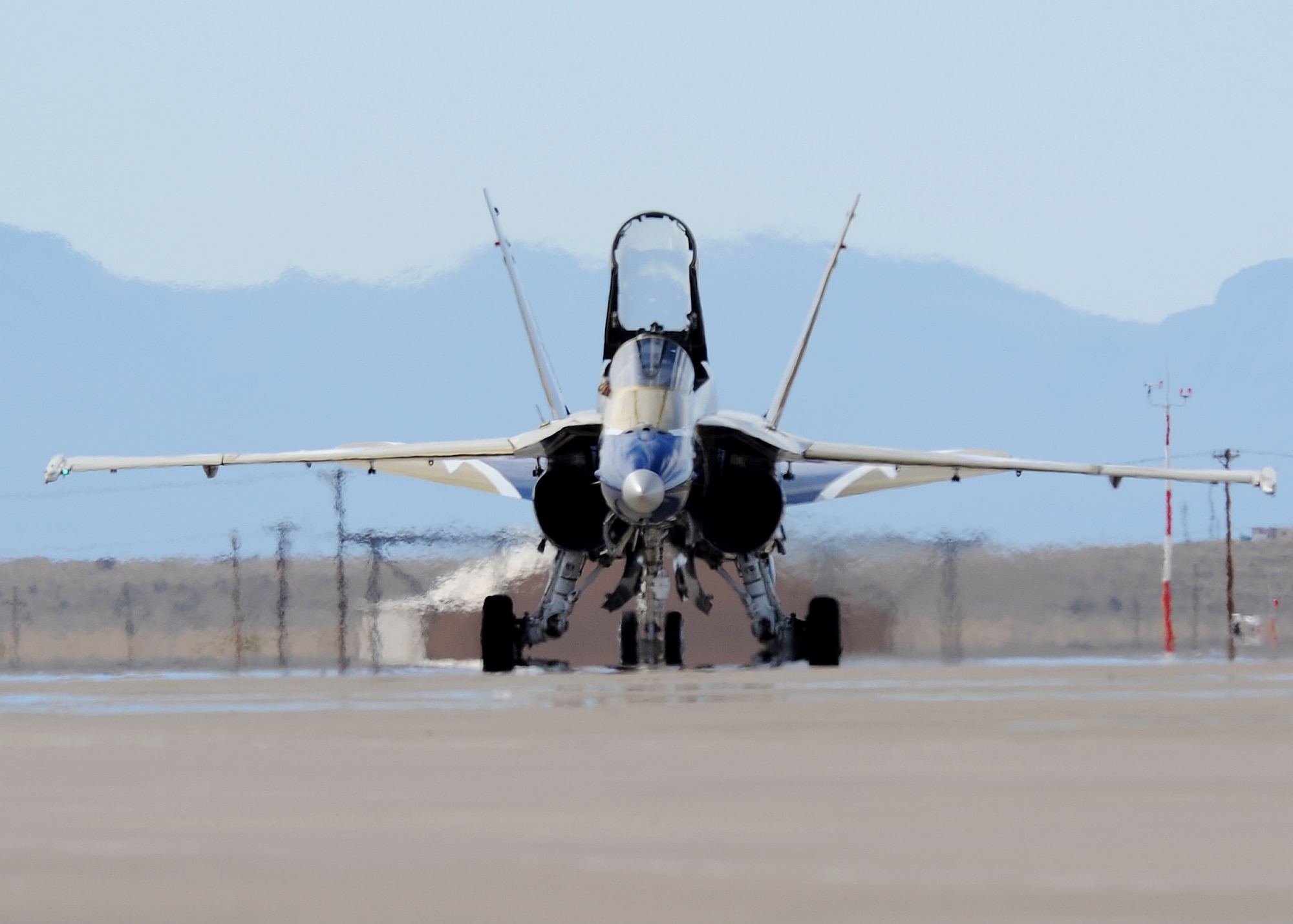 HOLLOMAN AIR FORCE BASE, N.M. -- A Canadian air force CF-18 Hornet taxis after completing it?s final aerial demonstration during the 2009 open house here, Oct. 24.  The German and Canadian air forces were both represented during the event, making ?Raptors and Reapers over the Southwest? an international open house.  (U.S. Air Force photo by Senior Airman John D. Strong II)    