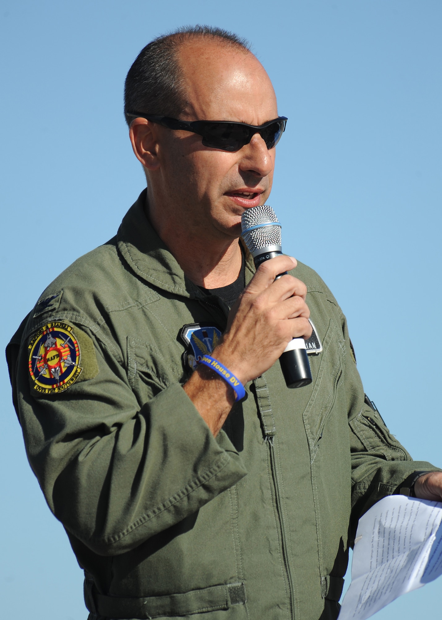 HOLLOMAN AIR FORCE BASE, N.M. -- Col. Jeff Harrigian, 49th Fighter Wing commander, speaks at the open house, Oct. 24. The open house showcased military and civilian aircraft, all three New Mexico bases and all branches of the military.The event helps educate the public on Air Force capabilities, increase recruiting and show appreciation to the local community. (U.S. Air Force photo by Senior Airman Michael Means)