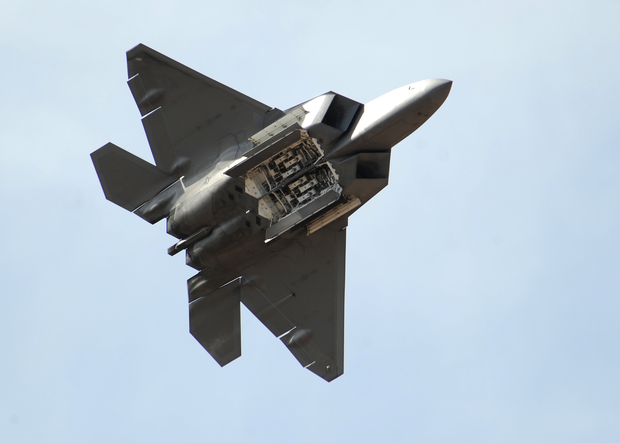 HOLLOMAN AIR FORCE BASE, N.M. ? The F-22A demonstration team performs during the 2009 open house here Oct. 24. The team, based at Langley Air Force Base, Va., performed with Holloman F-22?s. The open house featured both military and civilian aircraft, all three New Mexico bases and all branches of the military. (U.S. Air Force photo by Senior Airman Michael Means)