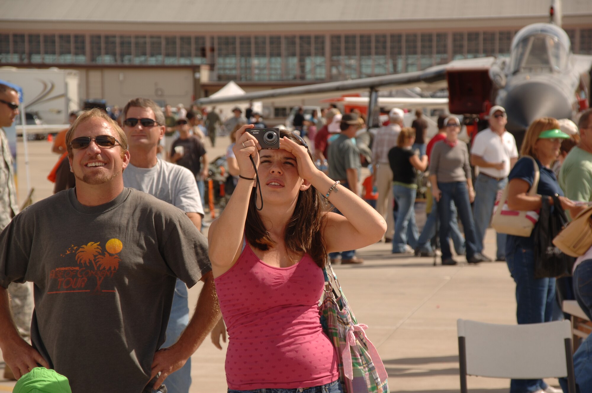 HOLLOMAN AIR FORCE BASE, N.M. -- Andrew Jauch and Shalane DuQuette of Tularosa watch an aerial performance at the 2009 open house here Oct. 24. The Holloman Open House showcased military and civilian aircraft. (U.S. Air Force photo by Staff Sgt. Sanjay Allen)
