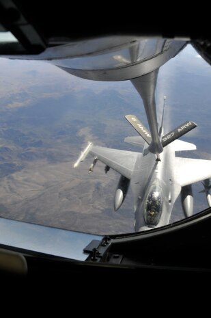 NELLIS AIR FORCE BASE, Nev. -- A Royal Netherlands Air Force F-16 is refueled by a KC-135 and aircrew from the 91st Air Refueling Squadron, MacDill Air Force Base, Fla., during a Red Flag 10-1 refueling mission over the Nevada Test and Training Range Oct. 22, 2009.  Aircrews from MacDill are pivotal to keeping Red Flag missions airborne for extended periods of time and are scheduled to push more than 1.4 million pounds of fuel to fighters and other support aircraft during the exercise which runs through Oct. 30.  (U.S. Air Force photo/Tech. Sgt. Chris Stagner)