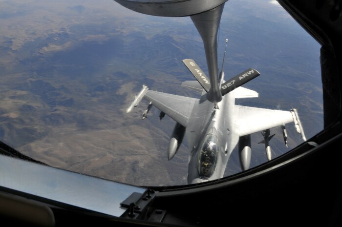 NELLIS AIR FORCE BASE, Nev. -- A Royal Netherlands Air Force F-16 is refueled by a KC-135 and aircrew from the 91st Air Refueling Squadron, MacDill Air Force Base, Fla., during a Red Flag 10-1 refueling mission over the Nevada Test and Training Range Oct. 22, 2009.  Aircrews from MacDill are pivotal to keeping Red Flag missions airborne for extended periods of time and are scheduled to push more than 1.4 million pounds of fuel to fighters and other support aircraft during the exercise which runs through Oct. 30.  (U.S. Air Force photo/Tech. Sgt. Chris Stagner)