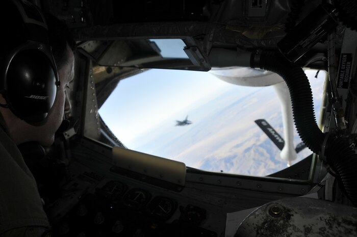 NELLIS AIR FORCE BASE, Nev. -- Staff Sgt. John Brooks, a KC-135 boom operator with the 91st Air Refueling Squadron, MacDill Air Force Base, Fla., prepares to refuel a flight of F-16s during a Red Flag 10-1 refueling mission over the Nevada Test and Training Range Oct. 22, 2009.  Aircrews from MacDill are pivotal to keeping Red Flag missions airborne for extended periods of time and are scheduled to push more than 1.4 million pounds of fuel to fighters and other support aircraft during the exercise which runs through Oct. 30.  (U.S. Air Force photo/Tech. Sgt. Chris Stagner)