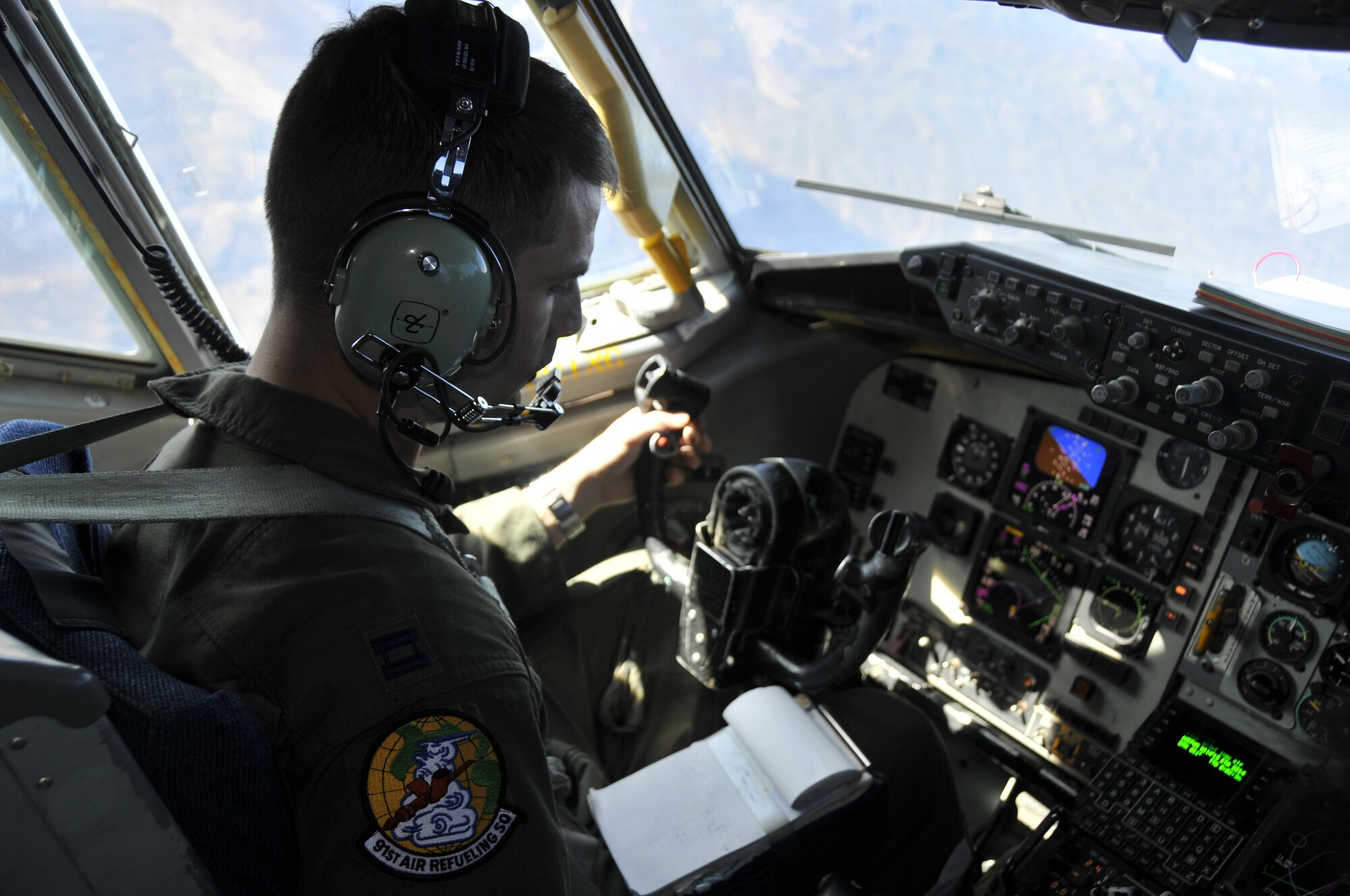 NELLIS AIR FORCE BASE, Nev. -- Capt. Mike Fulton, a KC-135 pilot with the 91st Air Refueling Squadron, MacDill Air Force Base, Fla., reviews mission data as he flies a refueling mission over the Nevada Test and Training Range in support of Red Flag 10-1 Oct. 22, 2009.  Aircrews from MacDill are pivotal to keeping Red Flag missions airborne for extended periods of time and are scheduled to push more than 1.4 million pounds of fuel to fighters and other support aircraft during the exercise which runs through Oct. 30.  (U.S. Air Force photo/Tech. Sgt. Chris Stagner)