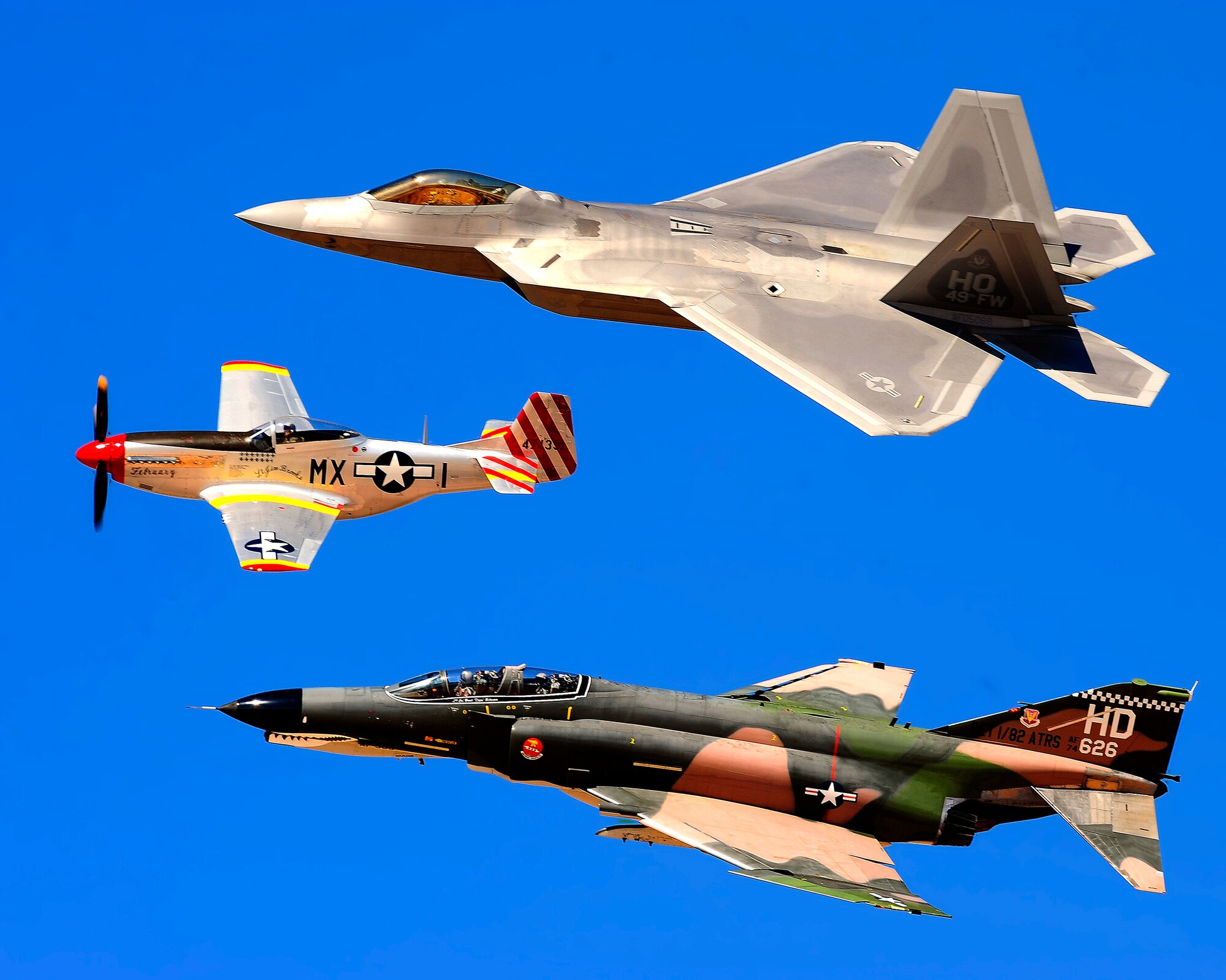 HOLLOMAN AIR FORCE BASE, N.M. -- A F-22A Raptor, P-51 Mustang and F-4 Phantom II practice the Heritage Pass here Oct. 23 before the Raptors and Reapers over the Southwest Open House. The open house starts at 9 a.m. and runs until 4:30 p.m. Oct. 24. (U.S. Air Force photo by Tech. Sgt. Chris Flahive)
