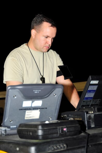 SOUTHWEST ASIA -Staff Sgt. Rickurt Jackman, 380th Expeditionary Aircraft Maintenance Squadron, operates a computer connected to an RQ-4 Global Hawk Oct. 22, 2009. Sergeant Jackman is deployed from Beale Air Force Base, Calif., and hails from Duluth, Minn. (U.S. Air Force photo/Tech. Sgt. Charles Larkin Sr)