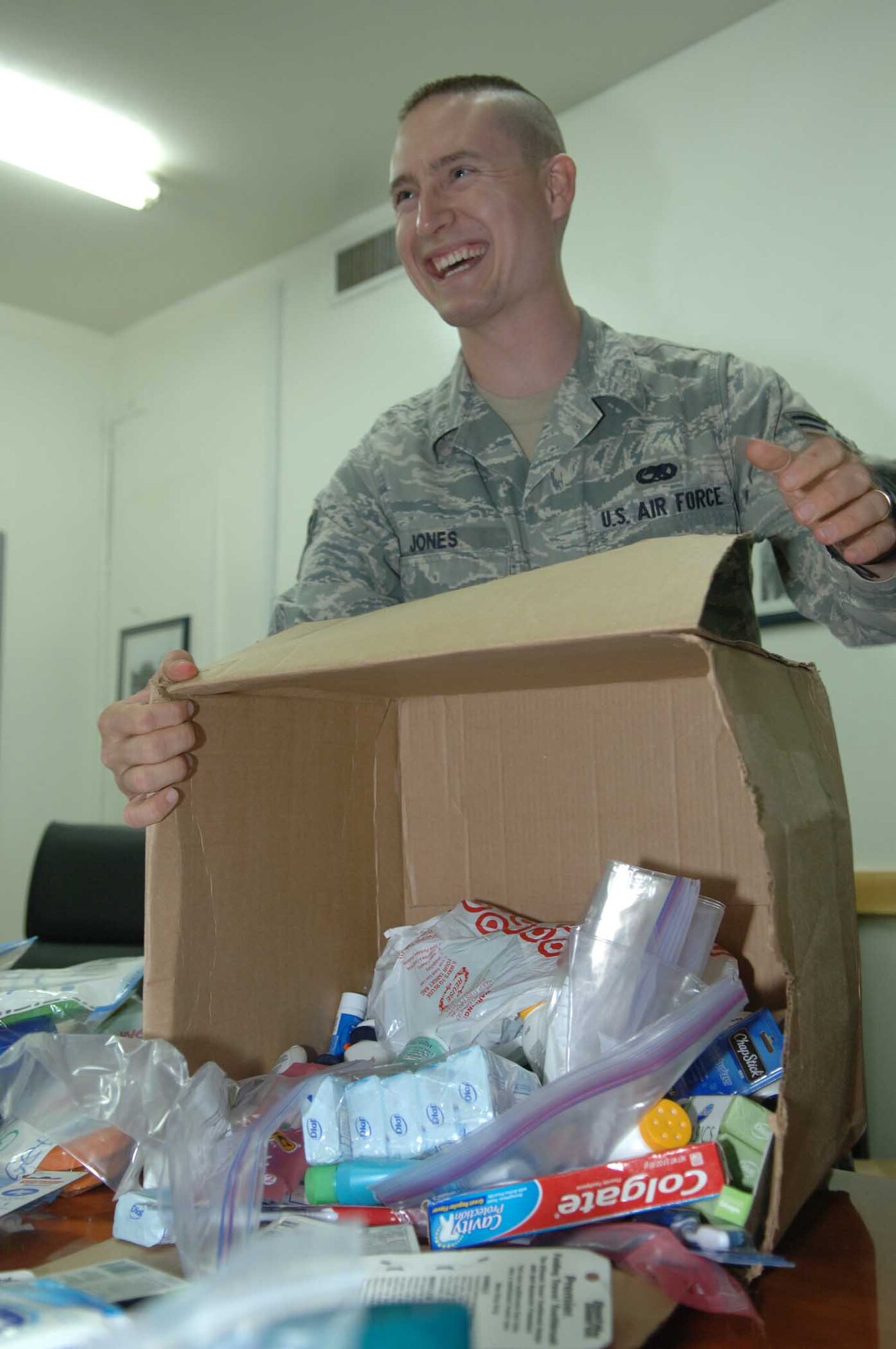 JOINT BASE BALAD, Iraq – Senior Airman Raymond Jones, 332nd Expeditionary Communications Squadron plans and programming project manager, inventories donations on their way to wounded servicemembers at Landstuhl Regional Medical Center, Germany, Oct. 13, 2009. Airman Jones decided to create the Balad Wounded Warriors Program after becoming injured during his deployment here. (U.S. Air Force photo/Senior Airman Andria J. Allmond)
