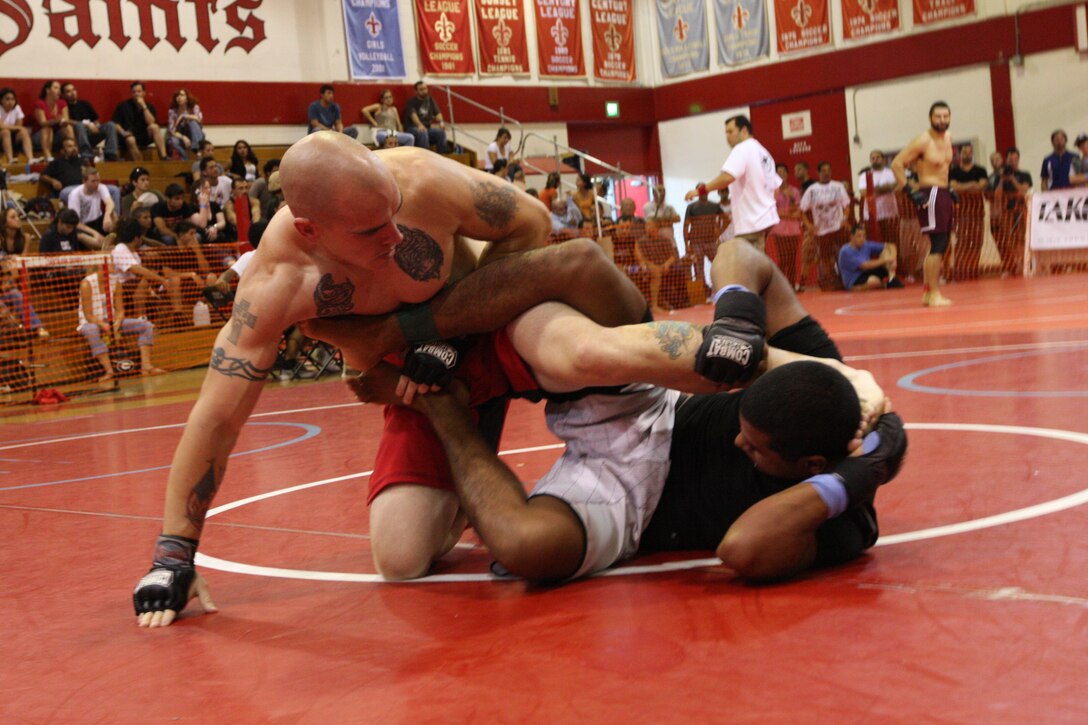 Matt Wheeler (left), a middle heavyweight member with Fight Club 29, grapples with an opposing team member during the U.S. National Pankration Championships in Santa Ana, Calif., Oct. 25.
