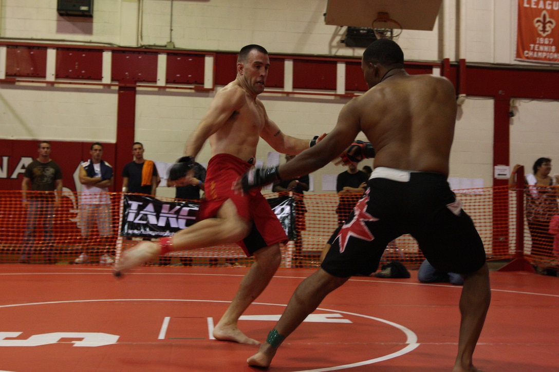 Kris Nekvinda, a 190-pound Fight Club 29 member, delivers a powerful body kick during the U.S. National Pankration Championships in Santa Ana, Calif., Oct 25.