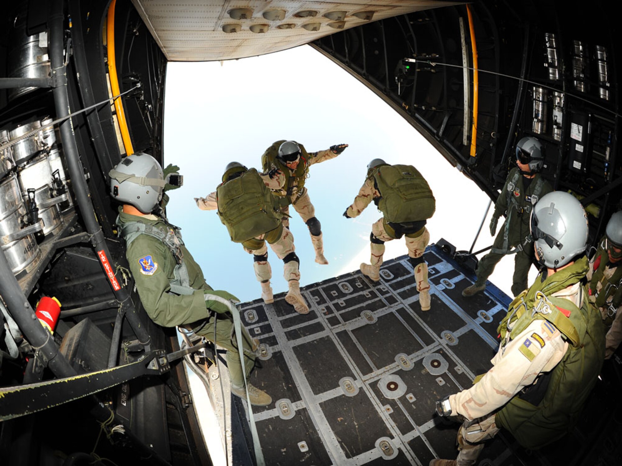 ANTOFAGASTA, Chile -- Pararescue jumpers from the Feurza Aerea de Chile or FACh, leap from a U.S. Air Force HC-130 Oct. 22 during SALITRE, a multinational exercise focused on interoperability between Chile, the United States, Argentina, Brazil and France. (U.S. Air Force photo by Master Sgt. Daniel Farrell)