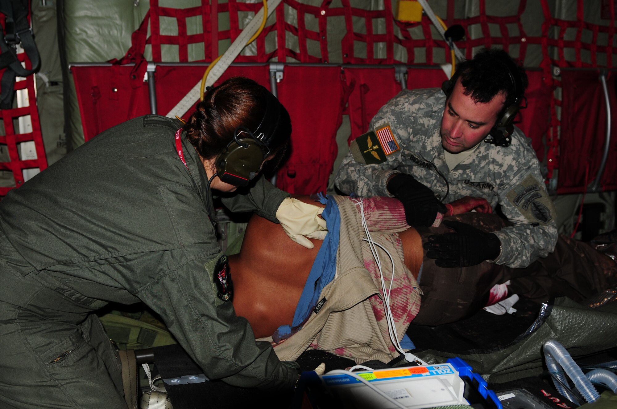 Tech. Sgt. Melissa Worley,  an independent duty medical technician from the 353rd Operations Squadron at Kadena Air Base, Japan, and Army Staff Sgt. Peter Biggane, conduct a primary assessment of a victim's injuries during a casualty evacuation exercise at Air Force Station Agra, India. Cope India is a United States and India airlift exercise that provides training for humanitarian assistance and disaster relief operations. (U.S. Air Force photo/Capt. Genieve David)