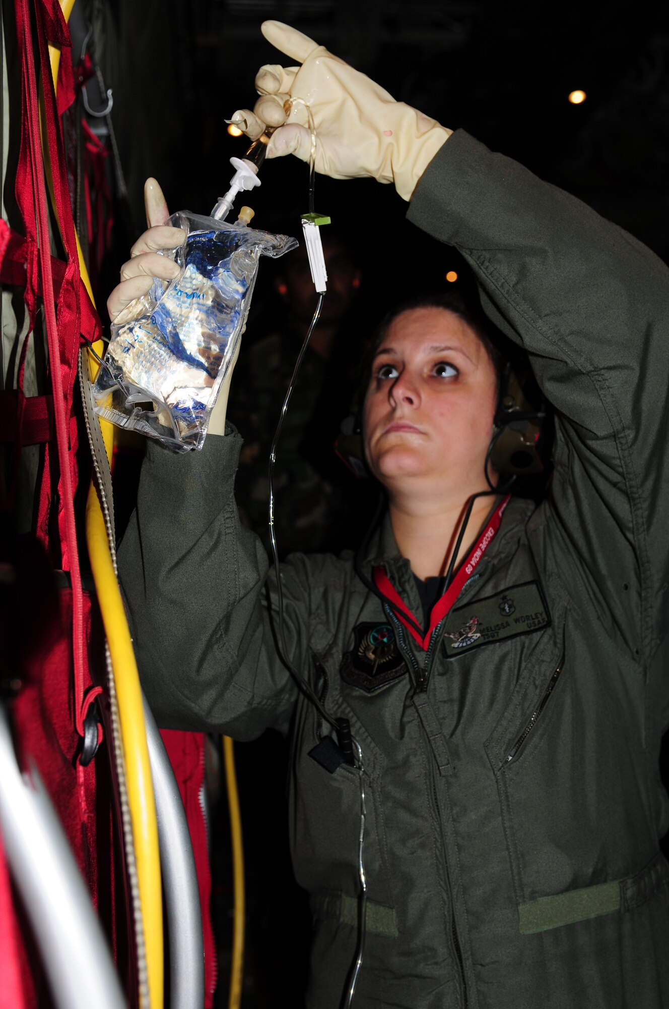 Tech. Sgt. Melissa Worley,   an independent duty medical technician from the 353rd Operations Squadron at Kadena Air Base, Japan, prepares a saline solution for a mock patient during a casualty evacuation exercise at Air Force Station Agra, India, Oct. 24. Cope India is a United States and India airlift exercise that provides training for humanitarian assistance and disaster relief operations. (U.S. Air Force photo/Capt. Genieve David)