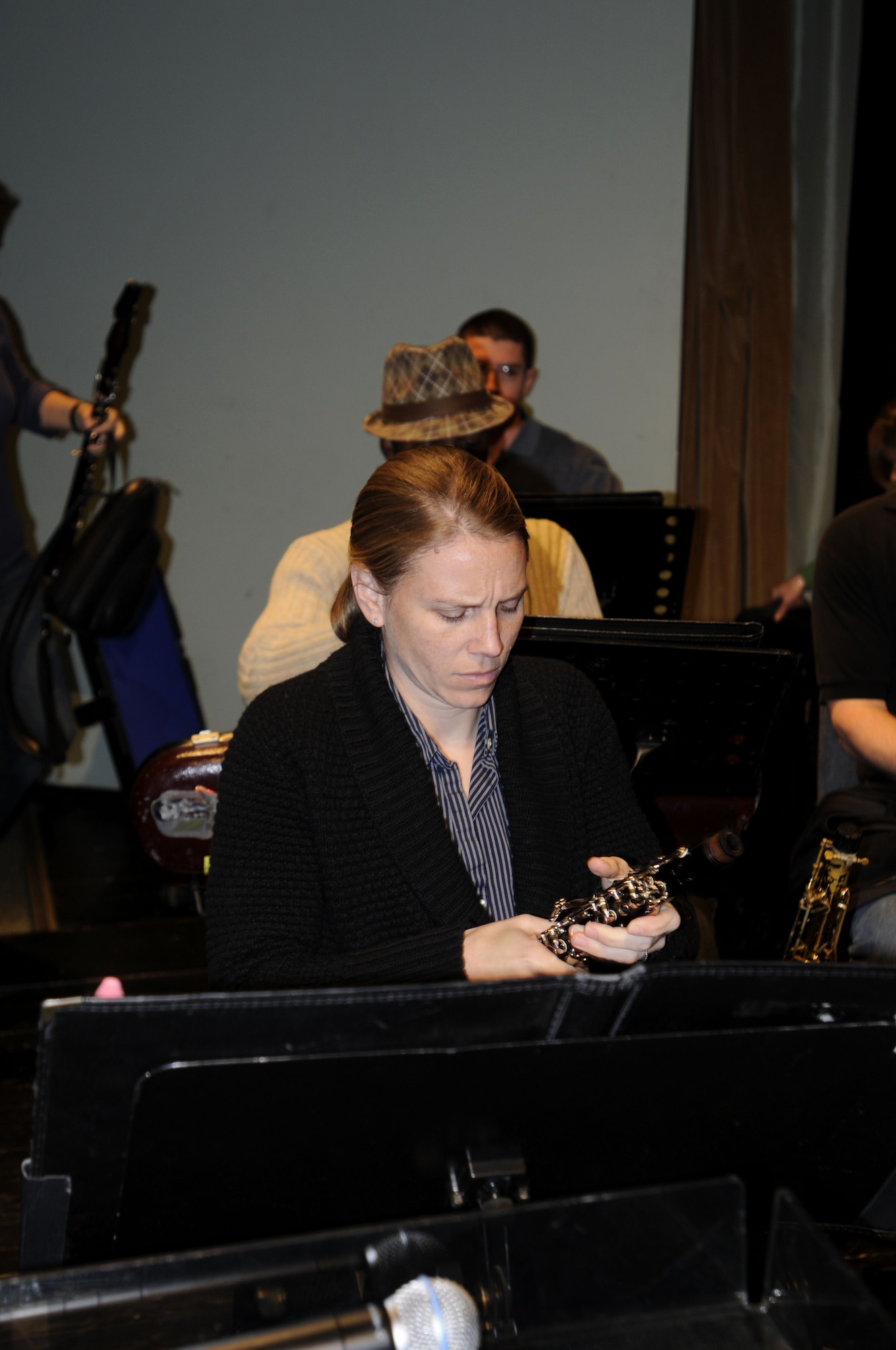 NOWY SACZ, Poland – Staff Sgt. Sandra Wellman prepares her clarinet for rehearsal here at the Malopolskie Centrum Kultury Sokol Oct. 22.  Sergeant Wellman is part of the 41-piece U.S. Air Forces in Europe’s Concert Band playing six concerts in six days, Oct. 20-25, to commemorate 90 years of Polish-American cooperation as part of Gen. Roger Brady’s, USAFE commander, international relations program in partnership with the U.S. State Department.  (U.S. Air Force photo/Master Sgt. Kelley J. Stewart)