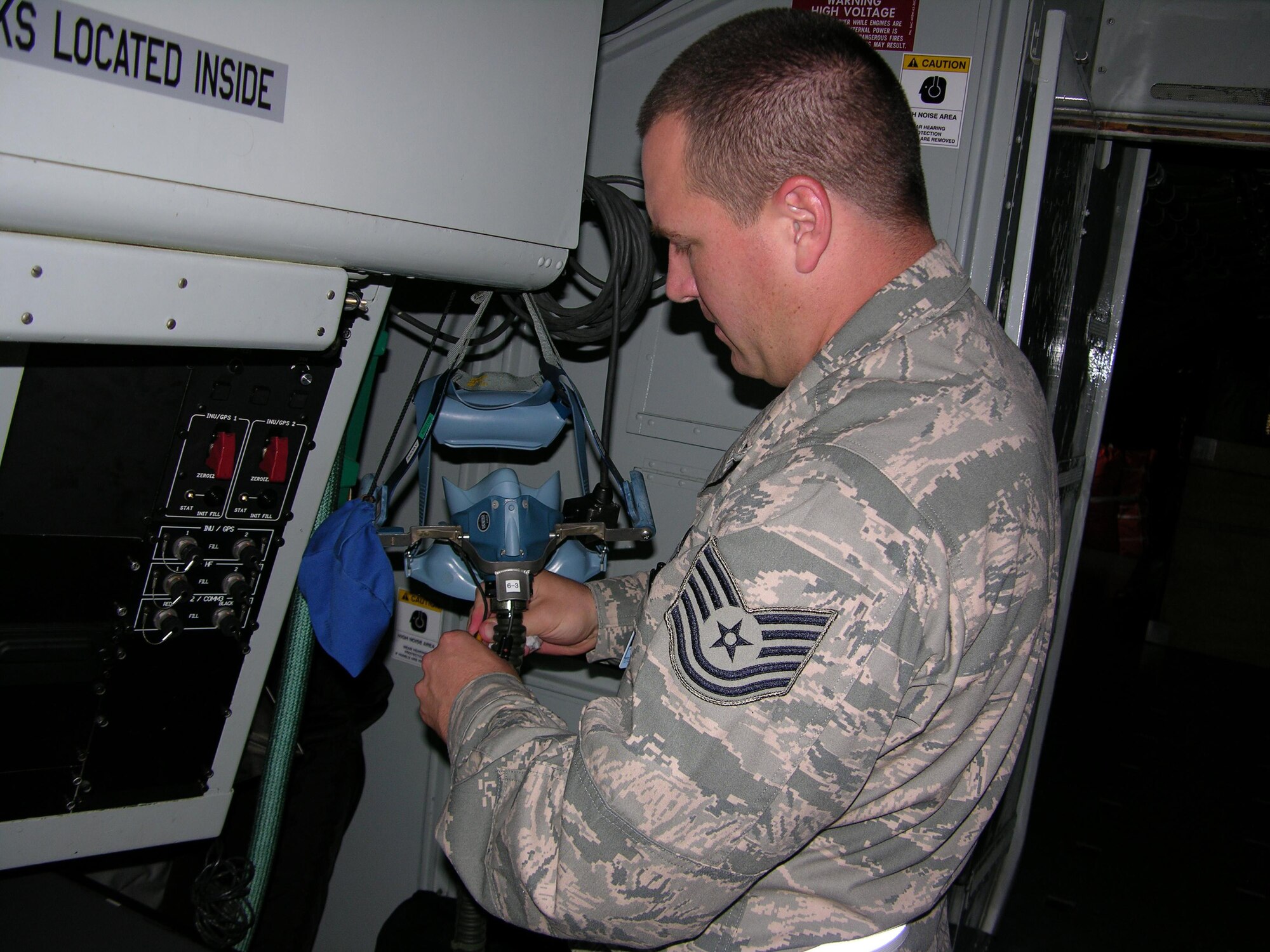 SEYMOUR JOHNSON AIR FORCE BASE, N.C. -- Tech. Sgt. T.J. Nelson cleans an aircrew quick don ensemble for use during an aircraft emergency. Sergeant Nelson is a Reservist with the 916th Operations Support Squadron and currently deployed to Guam.       
