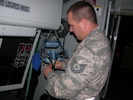 SEYMOUR JOHNSON AIR FORCE BASE, N.C. -- Tech. Sgt. T.J. Nelson cleans an aircrew quick don ensemble for use during an aircraft emergency. Sergeant Nelson is a Reservist with the 916th Operations Support Squadron and currently deployed to Guam.       