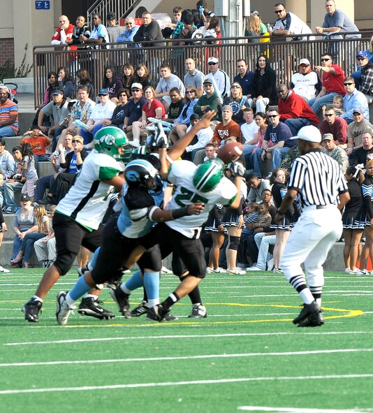 Osan American High School defensive lineman Dominic Olivero sacks Daegu American School running back David Martinez on an attempted halfback pass play in the second quarter of the teams' game Oct. 24 at Osan Air Base. OAHS won 28-26 to force a rematch Oct. 30 at DAS for a chance to advance to the Far East Korea Small Schools playoff. (U.S. Air Force Photo by 1st Lt. Chris Hoyler)