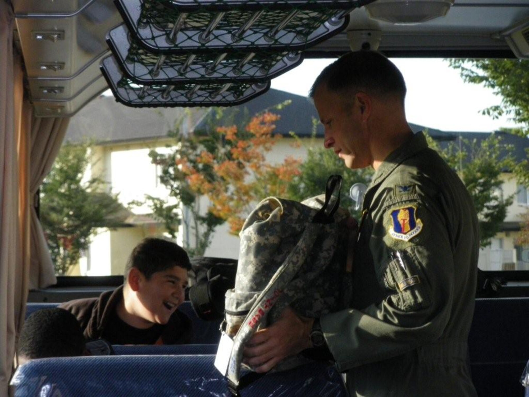 MISAWA AIR BASE, Japan -- Cummings Elementary School students cheerfully made room for one more rider on Thursday, 22 October, when Colonel RC Craig, 35th Fighter Wing Vice Commander and Misawa's School Liaison Officer, rode to school on their bus.