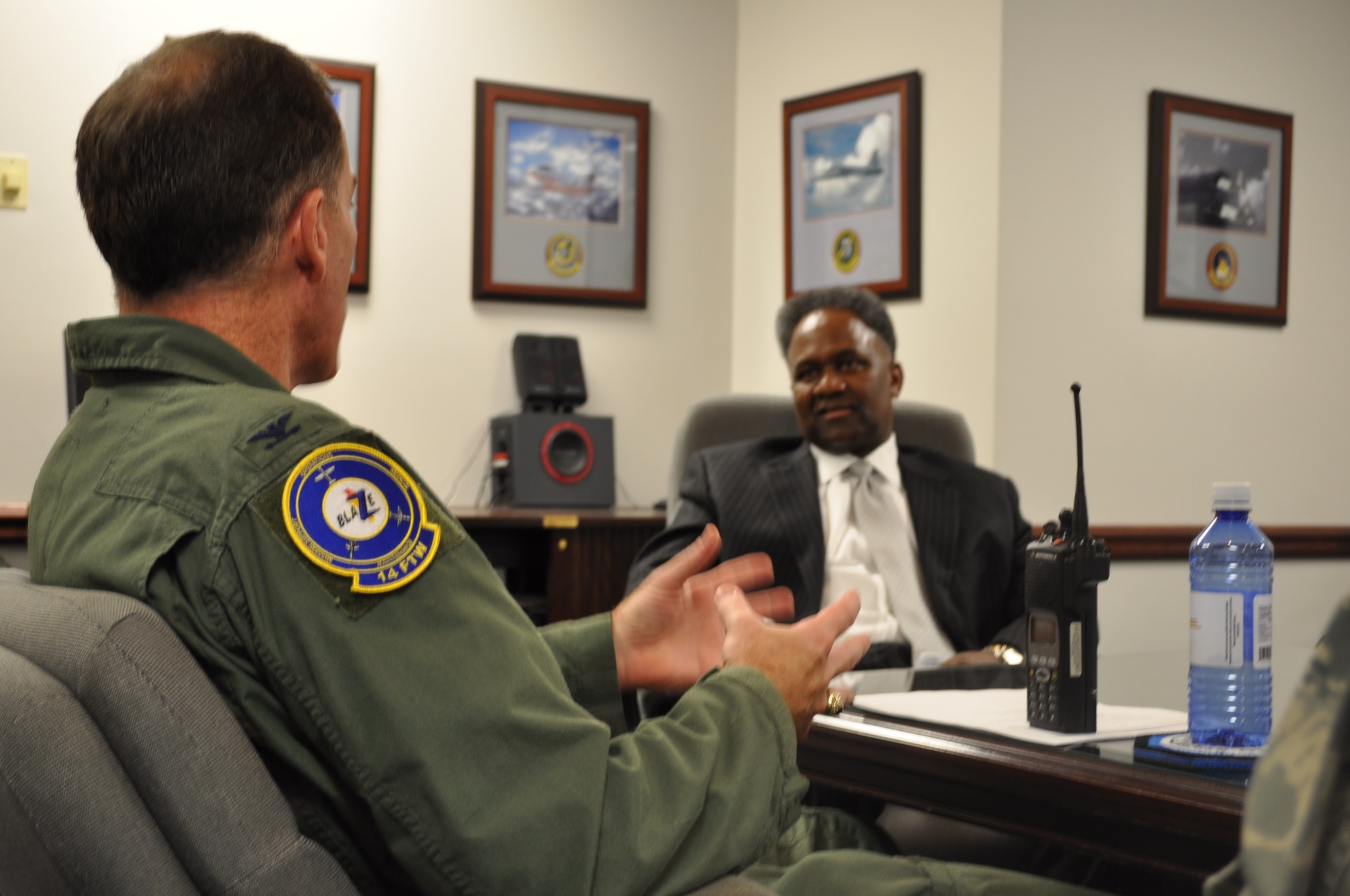 Col. George H. Ross, III, 14th Flying Training Wing vice commander, talks with Mr. Horace "H.L." Larry following Mr. Larry's Year of the Air Force Family presentation to base leaders Thursday, Oct 22 at Columbus AFB, Miss.  Mr. Larry, a member of the Senior Executive Service and the Deputy Director of Air Force Services, Deputy Chief of Staff for Manpower and Personnel, Headquarters U.S. Air Force, visited the men and women of Columbus AFB, Miss. October 22-23. (U.S. Air Force Photo/Sonic Johnson)