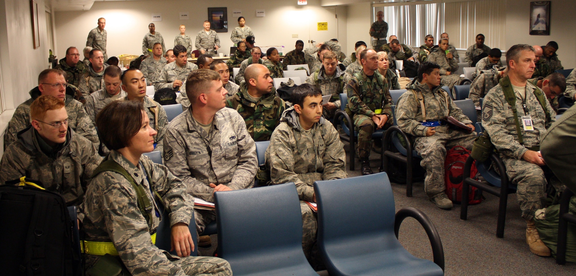 TRAVIS AIR FORCE BASE, Calif. -- Team Travis members attend a re-deployment briefing here after returning from Alpena, Mich. Both 349th and 60th wing personnel performed their missions under wartime conditions during the Operational Readiness Inspection. (U.S. Air Force photo/Master Sgt. Robert Wade)