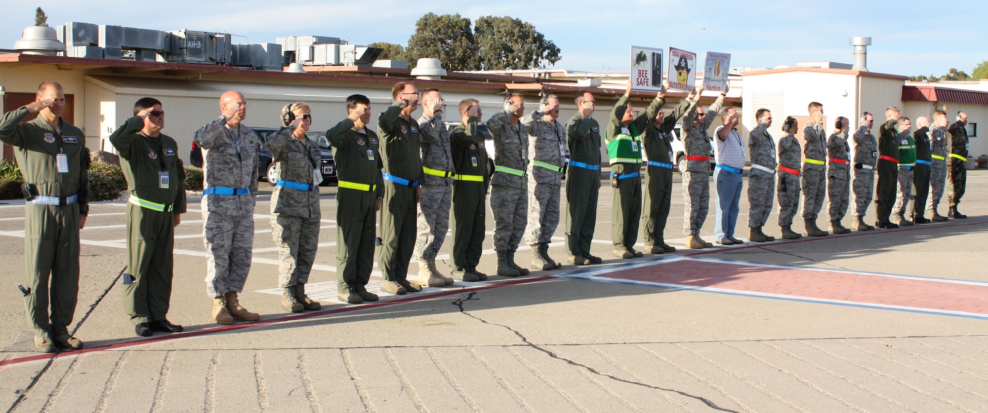 TRAVIS AIR FORCE BASE, Calif. -- Team Travis members, including Col. James Vechery, 60th AMW commander, and Col. Barrett Broussard, 349th AMW vice commander, welcome the last chalk from Alpena, Mich. The last chalk transported the Operational Readiness Inspection command teams lead by Brig. Gen. Maryanne Miller, 349th AMW commander, and Col. Michael Minihan, 60th AMW vice commander. (U.S. Air Force photo/Master Sgt. Robert Wade)