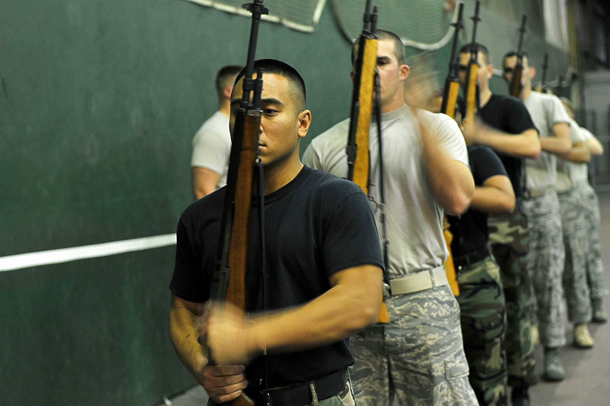 OFFUTT AIR FORCE BASE, Neb., -- Honor guard members from Offutt and numerous installations cock their rifles during a simulated 21-gun salute during an Air Force Honor Guard training session at the Martin Bomber Building here Oct. 21. The Air Force Honor Guard visited Offutt to evaluate and help sharpen the skills of Offutt's Honor Guard members, as well as honor guard members from numerous installations.
U.S. Air Force Photo by Charles Haymond