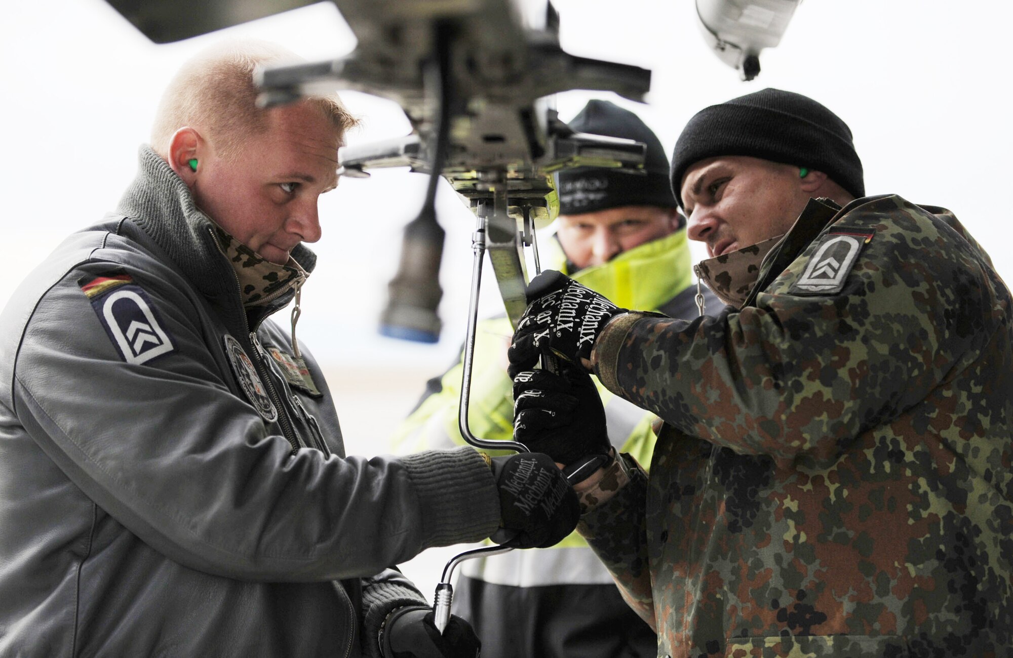 Tech. Sgt. Torsten Naujoks (left) and Tech. Sgt. Fabian Schoor, maintenance crew chiefs from the German air force Flying and Training Center at Holloman Air Force Base, N.M., perform post flight maintenance on a PA-200 Tornado Oct. 21, 2009, following a mission during the Mountain Roundup exercise at Mountain AFB, Idaho. Mountain Roundup is a large-force exercise running from Oct. 15 through Oct. 30 and includes participants from the German air force, U.S. Air Force, U.S. Navy and U.S. Marines. (U.S. Air Force photo/Airman 1st Class Renishia Richardson)