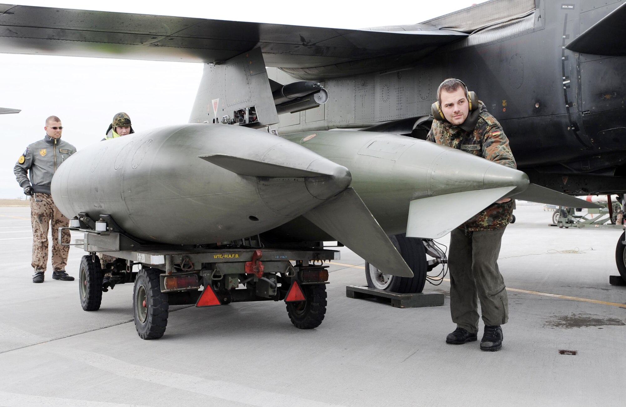 Staff Sgt. Martin Schweizer, a weapons journeyman from the German air force Flying and Training Center at Holloman Air Force Base, N.M., helps perform post-flight maintenance on a PA-200 Tornado Oct. 21, 2009, during the Mountain Roundup exercise at Mountain Home AFB, Idaho. Mountain Roundup is a large-force exercise running from Oct. 15 through Oct. 30 and includes participants from the German air force, U.S. Air Force, U.S. Navy and U.S. Marines. (U.S. Air Force photo/Airman 1st Class Debbie Lockhart)