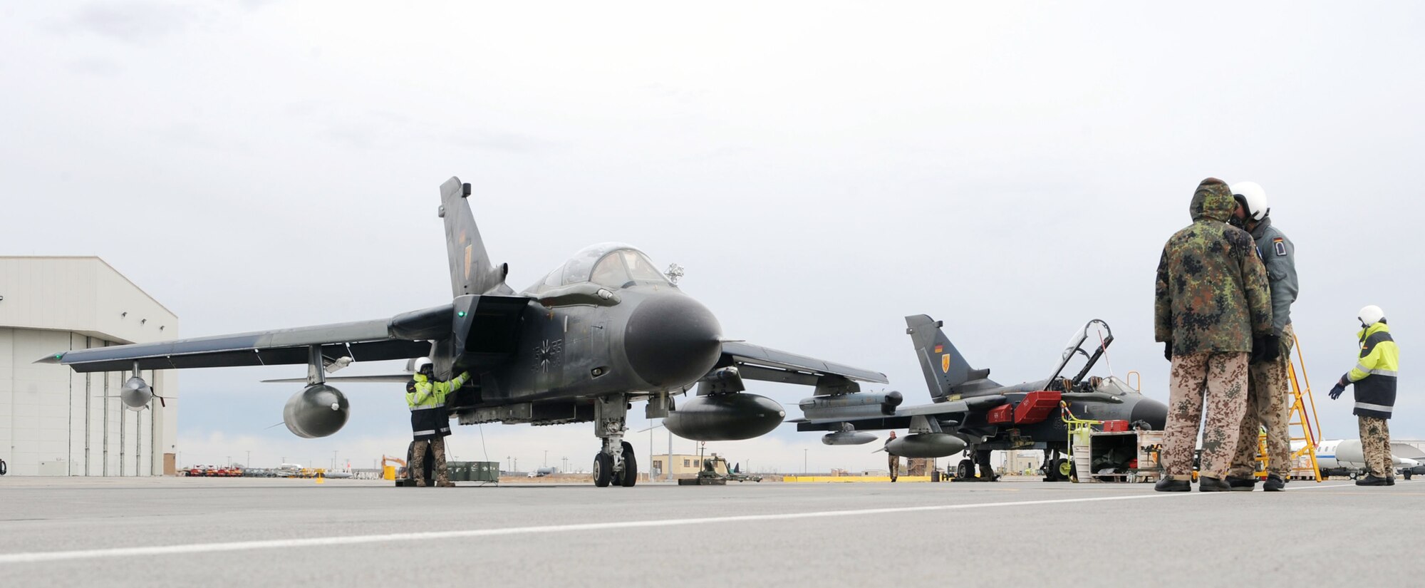 Maintainers from the German air force Flying and Training Center at Holloman Air Force Base, N.M., stand by as a PA-200 Tornado gets ready to taxi out for a mission Oct. 21, 2009, during the Mountain Roundup exercise at Mountain Home AFB, Idaho.  Mountain Roundup is a large-force exercise running Oct. 15 through Oct. 30 and includes participants from the German air force, U.S. Air Force, U.S. Navy and U.S. Marines. (U.S. Air Force photo/Airman 1st Class Debbie Lockhart)