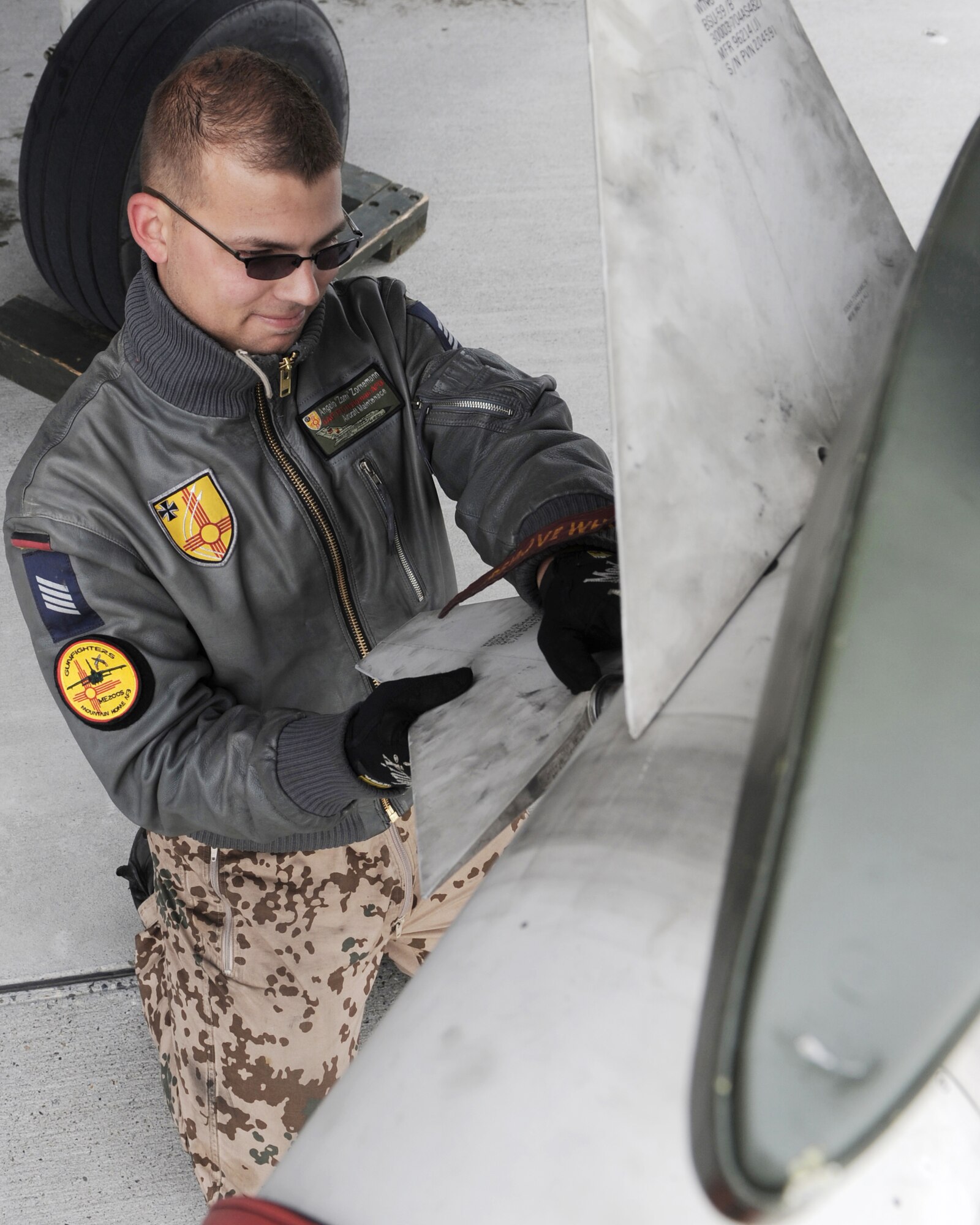 Senior Airman Angelo Zornemann, a maintenance journeyman from the German air force Flying and Training Center at Holloman Air Force Base, N.M., attaches a fin to an AIM-9 sidewinder missile Oct. 21, 2009, during the Mountain Roundup exercise at Mountain Home AFB, Idaho. Mountain Roundup is a large-force exercise running from Oct. 15 through Oct. 30 and includes participants from the German air force, U.S. Air Force, U.S. Navy and U.S. Marines. (U.S. Air Force photo/Airman 1st Class Debbie Lockhart)