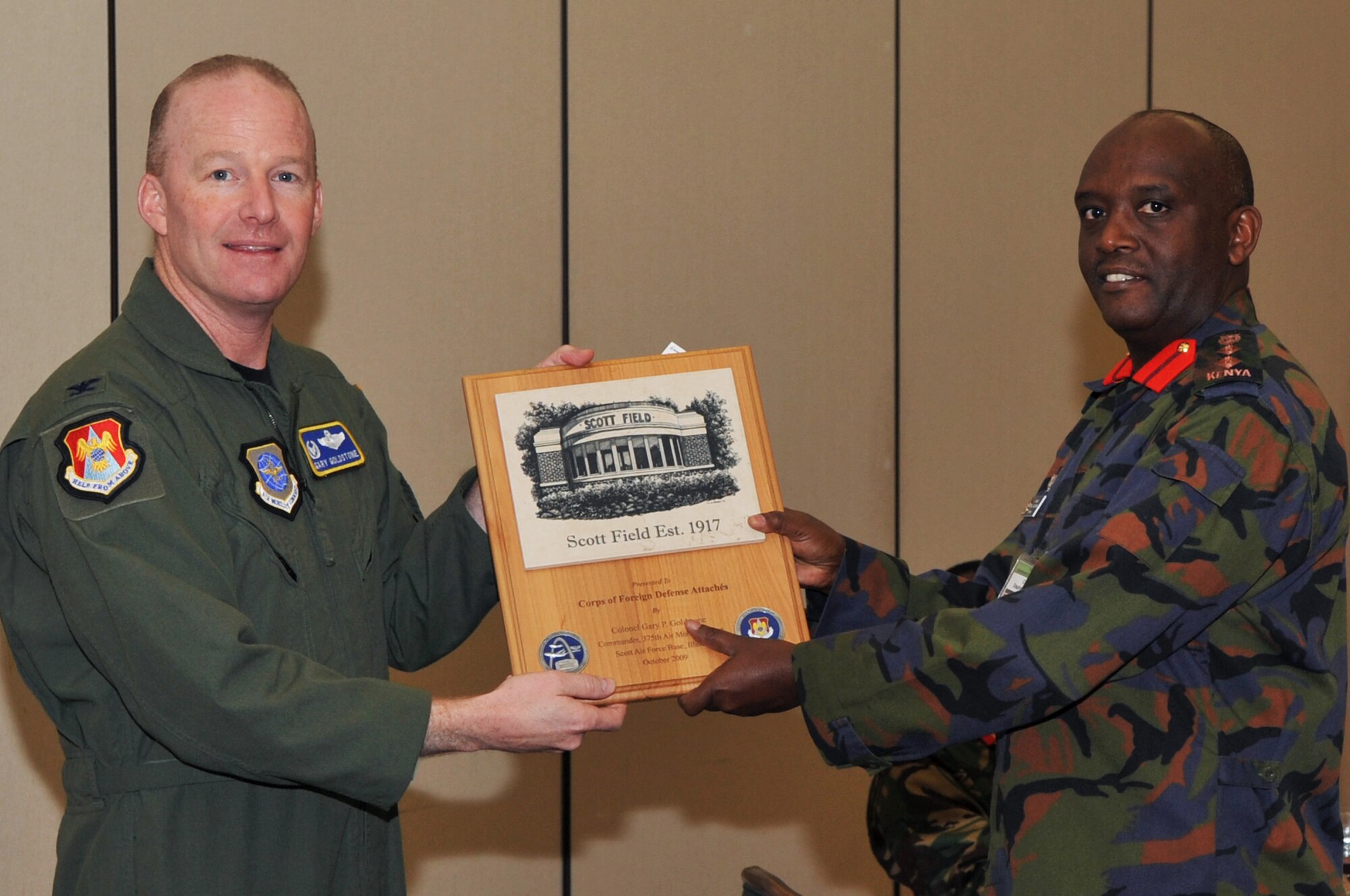 SCOTT AIR FORCE BASE, Ill. -- Col. Gary Goldstone, 375th Air Mobility Wing commander (left) gives a plaque to Col. Stephen Gababo, Kenyan foreign defense attaché during a two-day visit to Scott Oct. 20.
(U.S. Air Force photo/ Senior Airman Teresa Jennings)
