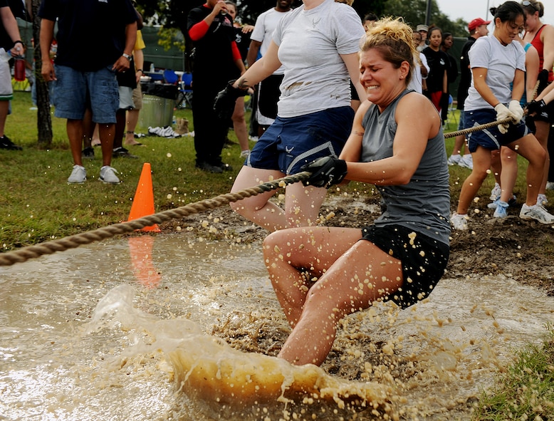 MOODY AIR FORCE BASE, Ga. -- Staff Sgt. Heather Warden, 23rd Wing Protocol NCO in-charge, attempts one final pull to keep her team out of the water pit during the final round of the all-female tug-of-war competition at Super Sports Day here Oct. 23. Super Sports Day is an all-day event, where Airmen compete in numerous events to earn points and bragging rights for their organization. (U.S. Air Force photo by Airman 1st Class Joshua Green)