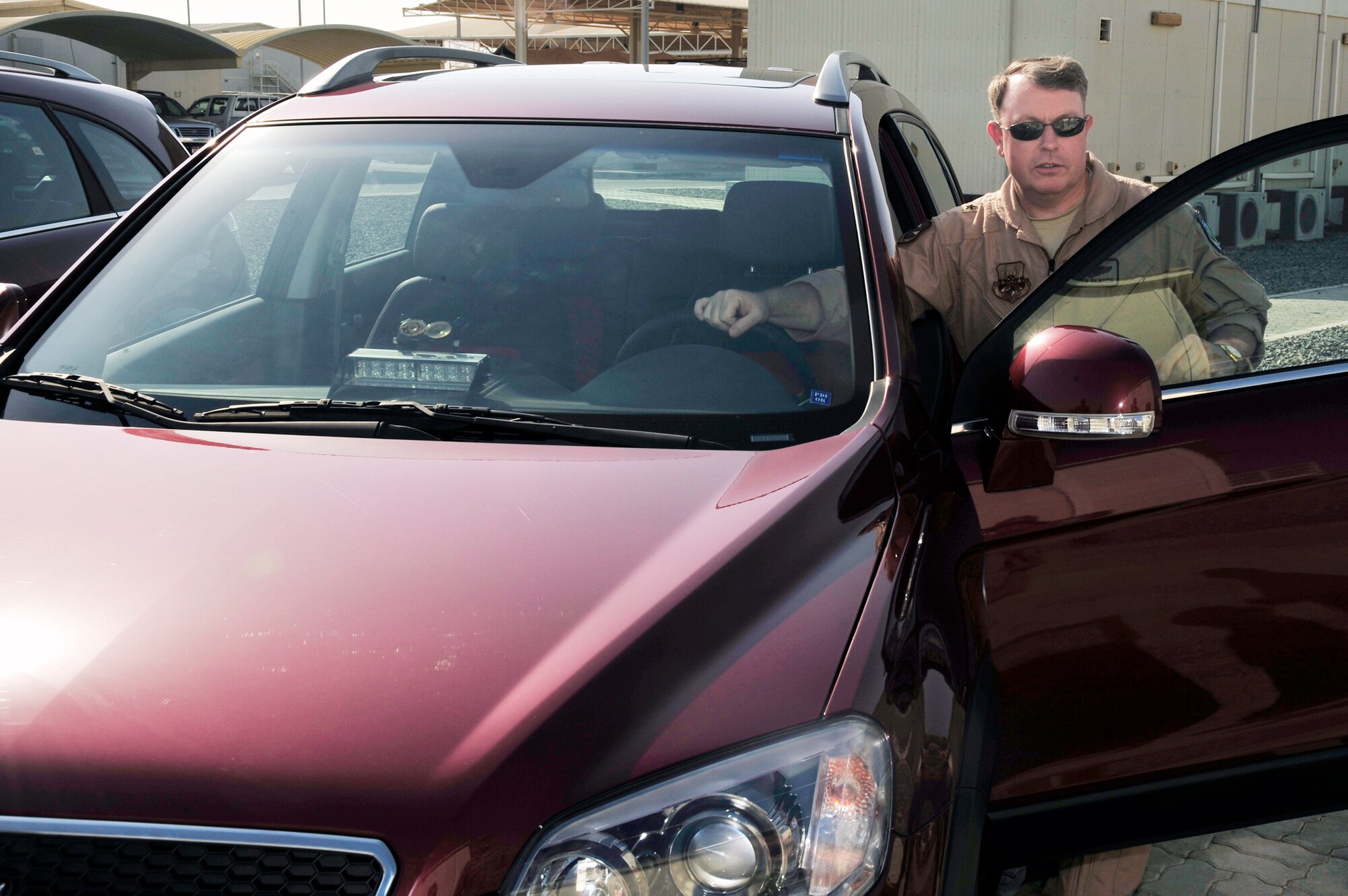 Brig. Gen. Bryan J. Benson prepares to test drive his new staff vehicle Oct. 26, 2009, at an air base in Southwest Asia. General Benson received the new vehicle to comply with new Department of Defense directives. General Benson is the 380th Air Expeditionary Wing commander. (U.S. Air Force photo/Tech. Sgt. Charles Larkin Sr.) 
