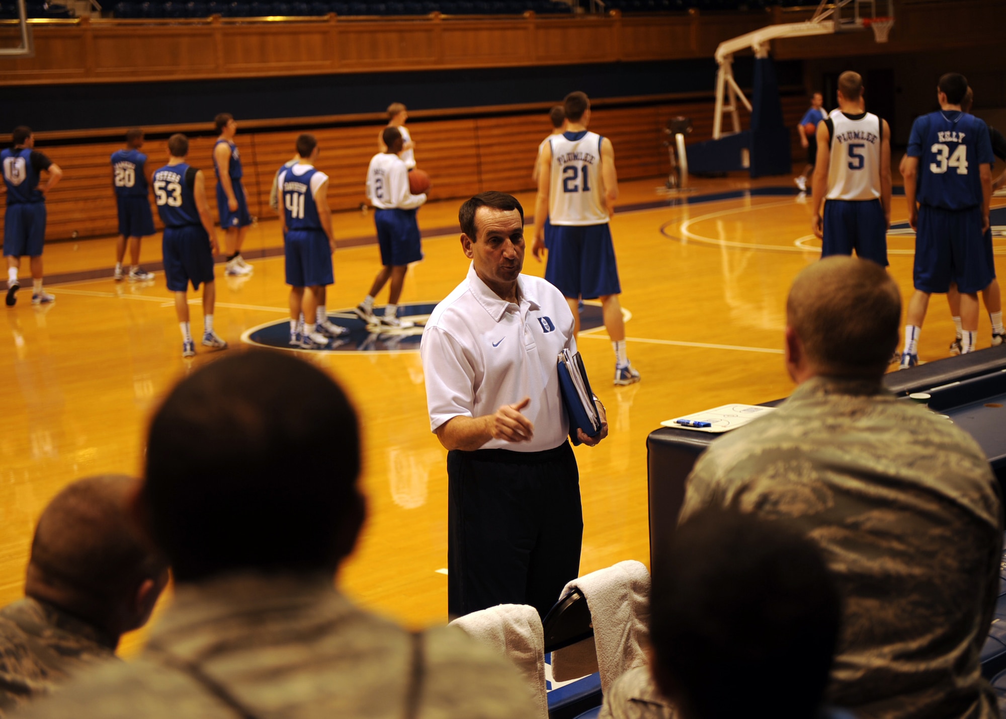 Duke University men's basketball head coach Mike Krzyzewski, better known as "Coach K," speaks to Airmen from Seymour Johnson Air Force Base, N.C., during a closed practice at Cameron Indoor Stadium at Duke University Oct. 21, 2009. The trip to Duke was sponsored by the 4th Force Support Squadron after being highly requested by Team Seymour's Airmen. (U.S. Air Force photo/Senior Airman Ciara Wymbs)  