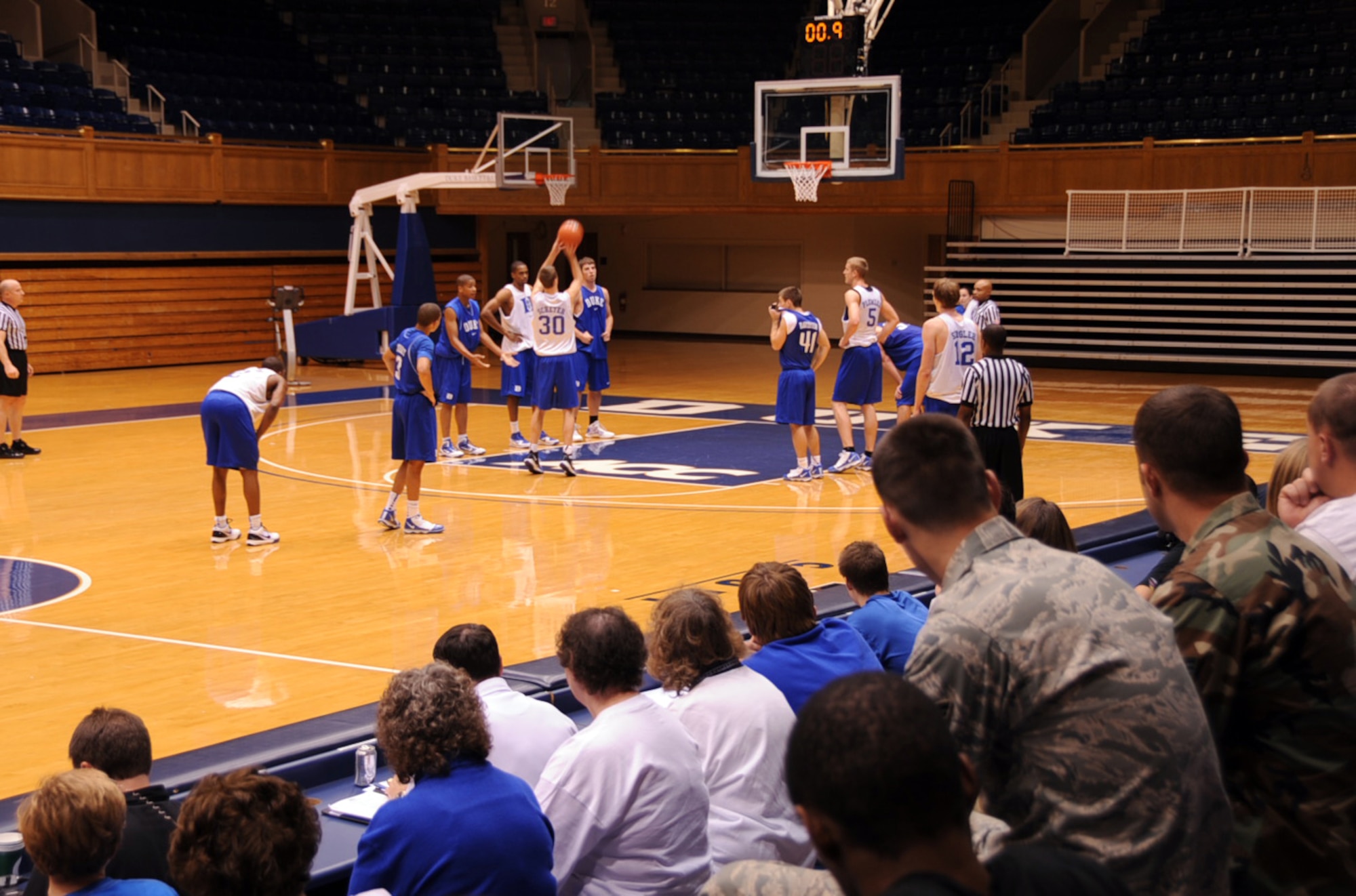 Members from Seymour Johnson Air Force Base, N.C., watch the Duke University men's basketball team scrimmage at the Cameron Indoor Stadium at Duke University Oct. 21, 2009. The 4th Force Support Squadron tries to boost morale among Airmen by accommodating requests to get more involved in off base events. (U.S. Air Force photo/Senior Airman Ciara Wymbs)