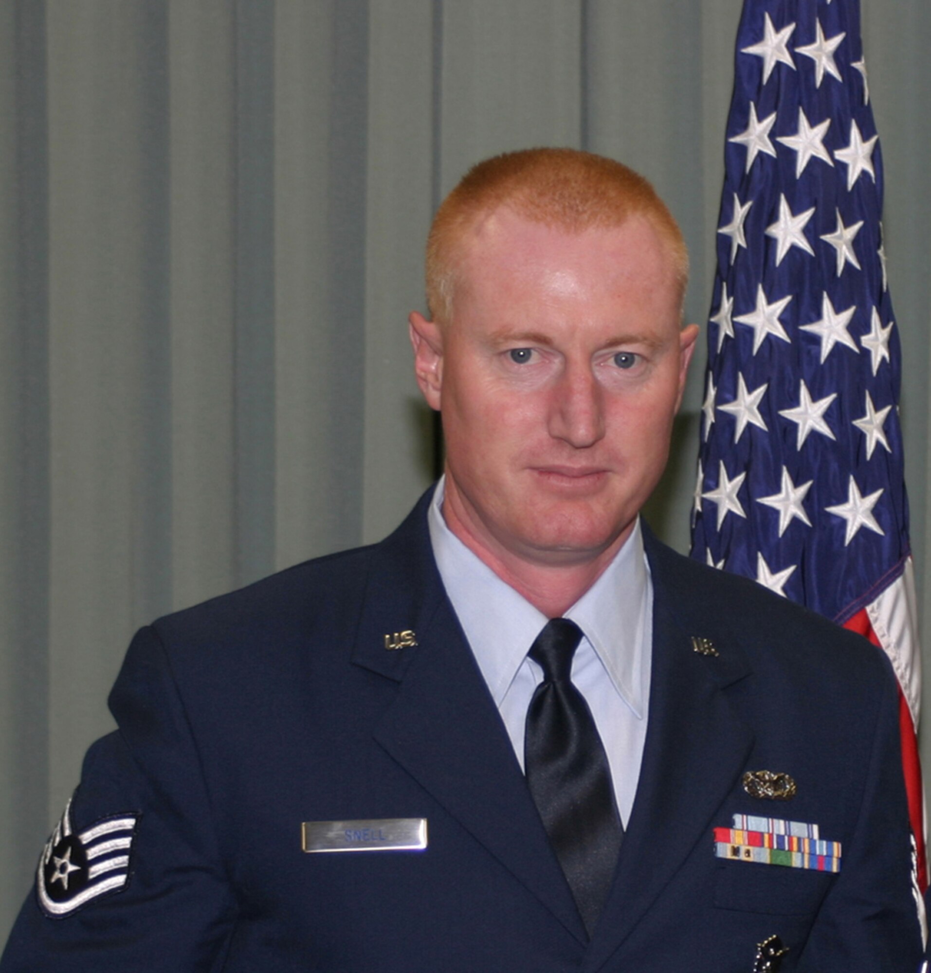 WRIGHT-PATTERSON AIR FORCE BASE, Ohio - Staff Sgt. Jude Snell, a reservist from the 445th Security Forces Squadron currently assigned to the 506th Expeditionary Security Forces Squadron, Kirkuk Regional Air Base, Iraq, received a pat on the back for his quick thinking prior to a recent Iraqi Air Force rotor wing pilot graduation. Sergeant Snell volunteered to drive 25 local reporters to the ceremony when the coordination for transportation broke down. (Courtesy photo)