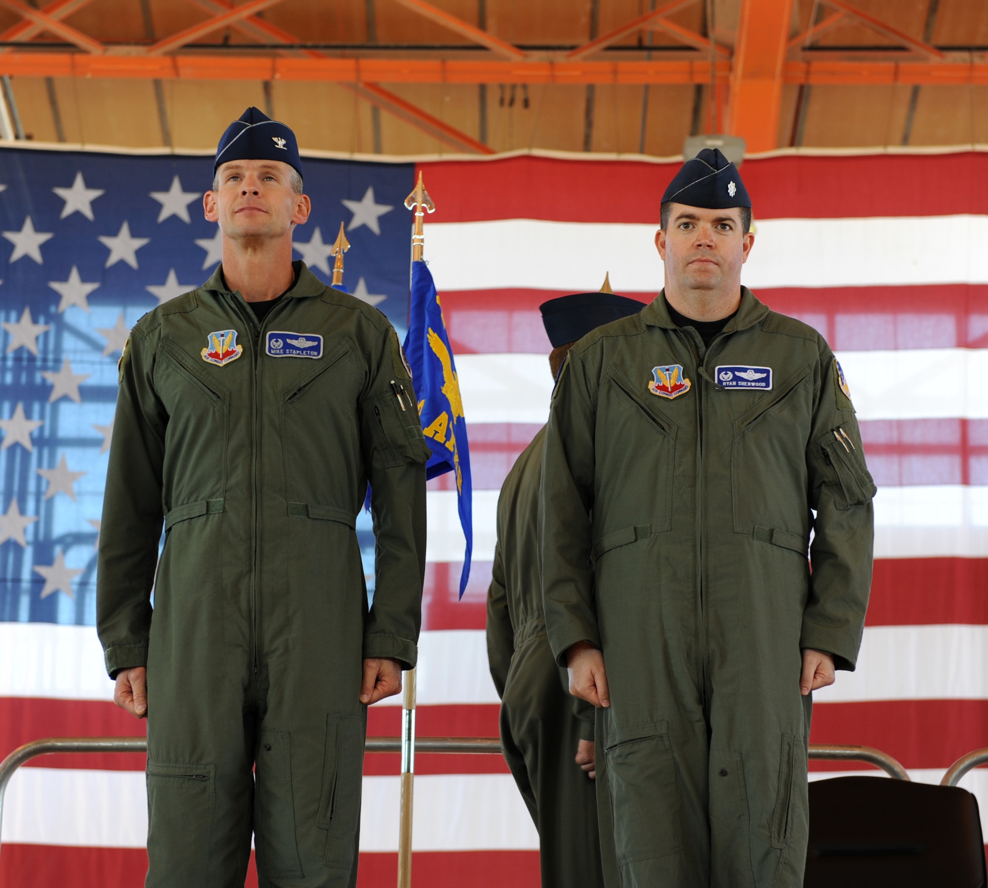 HOLLOMAN AIR FORCE BASE, N.M. -- Col. Michael Stapleton, 49th Operations Group commander, and Lt. Col. Ryan Sherwood, 6th Reconnaissance Squadron commander, stand at attention while the orders of the assumption are read during an assumption of command ceremony here Oct. 23. The 6th RS, 29th Attack Squadron, 16th Training Squadron and 849th Aircraft Maintenance Squadron -- all remotely piloted vehicle squadrons -- officially stood up under the 49th Fighter Wing during the ceremony. (U.S. Air Force photo by Senior Airman John D. Strong II)