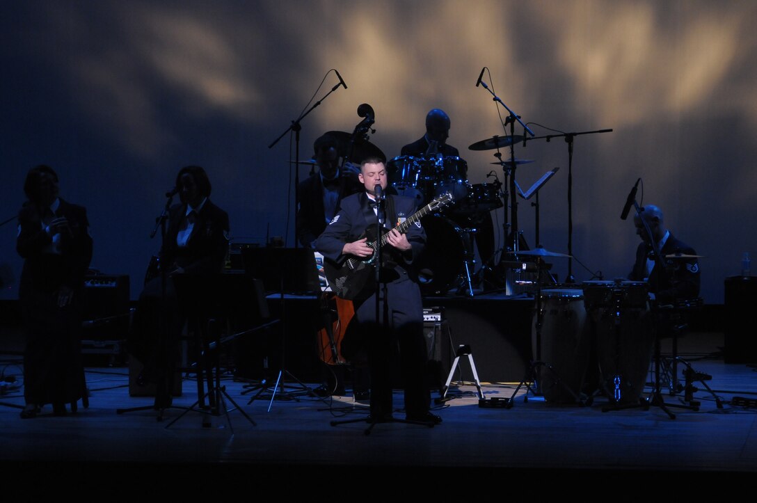 HIROSHIMA, Japan -- Staff Sgt. Daniel Bragdon, U.S. Air Force Band of the Pacific-Asia, sings "Over the Rainbow" during an Oct. 13 performance at the Aster Plaza here. The venue is mere blocks away from the Hiroshima Peace Memorial Park, dedicated to the victims of the atomic bombing of the city at the end of World War II. (U.S. Air Force photo/Airman 1st Class Sean Martin)