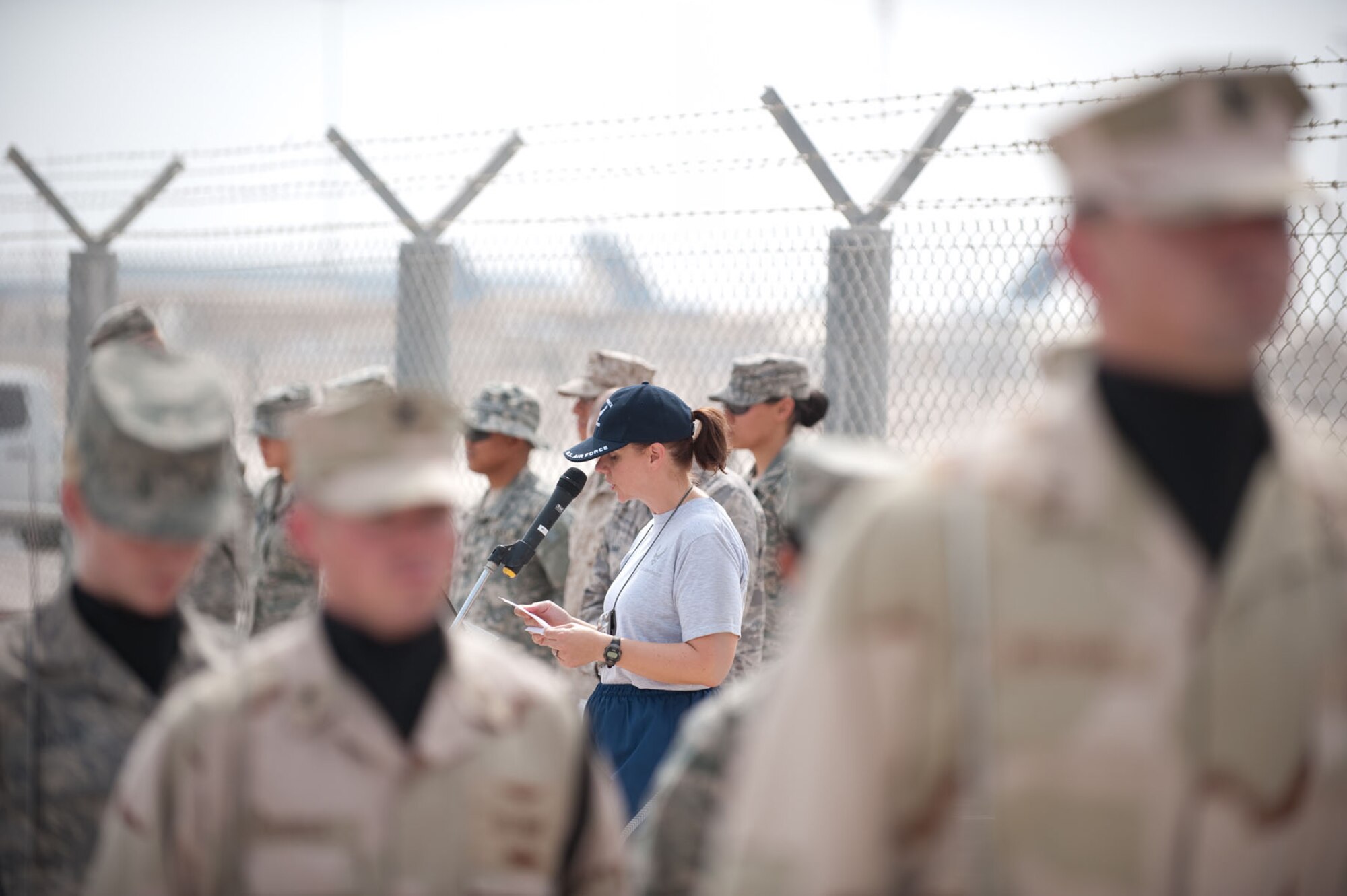 Chaplain (Maj.) Carol Yeager, 379th Air Expeditionary Wing, provides an invocation to start a POW/MIA memorial run, Oct. 24, 2009, in Southwest Asia. More than 200 military servicemembers ran, interchangeably, for 24 hours around a half-mile course, continuously carrying the POW/MIA flag to help raise awareness as well as more than $700 for the POW/MIA Combined Federal Campaign charity. (U.S. Air Force photo/Staff Sgt. Robert Barney) 