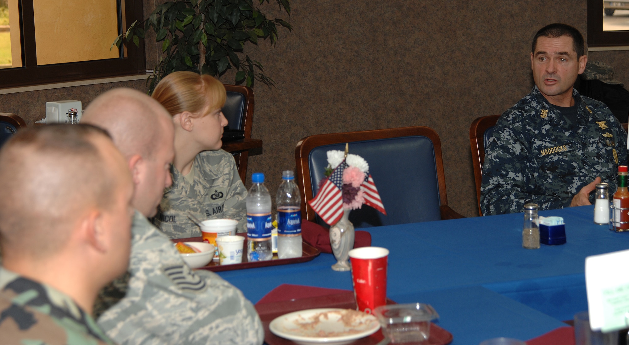 U.S. Navy Fleet Master Chief Petty Officer Roy M. Maddocks, Jr, U.S. European Command senior enlisted leader, listens as Airman 1st Class Kate Lozier, American Forces Network Incirlik, asks him a question during a breakfast Friday, Oct. 23, 2009 at Incirlik Air Base, Turkey. The purpose of Master Chief Maddocks’ visit was to get opinions from all servicemembers on quality of life as well as offer his advice on a broad spectrum of topics such as saving money and contributing to the Thrift Savings Plan. (U.S. Air Force photo/Staff Sgt. Lauren Padden)