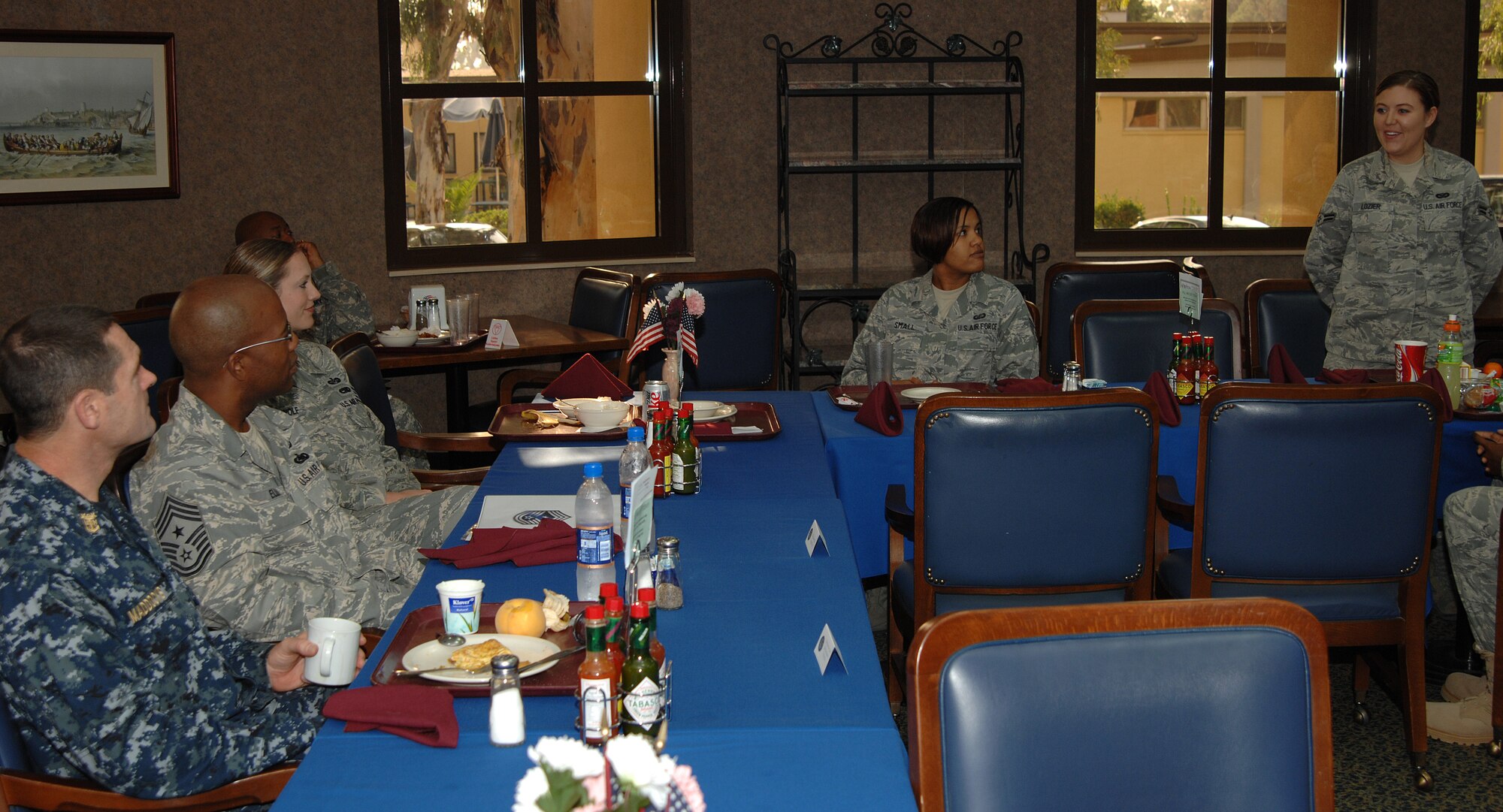 U.S. Navy Fleet Master Chief Petty Officer Roy M. Maddocks, Jr, U.S. European Command senior enlisted leader, listens as Airman 1st Class Kate Lozier, American Forces Network Incirlik, asks him a question during a breakfast Friday, Oct. 23, 2009 at Incirlik Air Base, Turkey. The purpose of Master Chief Maddocks’ visit was to get opinions from all servicemembers on quality of life as well as offer his advice on a broad spectrum of topics such as saving money and contributing to the Thrift Savings Plan. (U.S. Air Force photo/Staff Sgt. Lauren Padden)