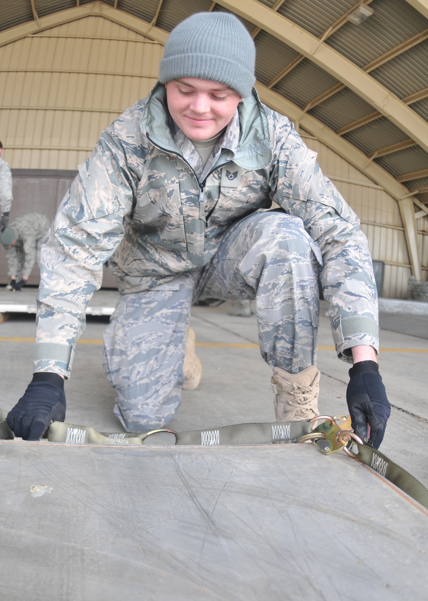 SPANGDAHLEM AIR BASE, Germany -- Staff Sgt. Michael Osborne, 606th Air Control Squadron, installs top net to a cargo pallet during cargo pallet buildup training Oct. 21. The purpose of the class was to give Airmen the skills needed for cargo movement. (U.S. Air Force photo/Airman 1st Class Nick Wilson)