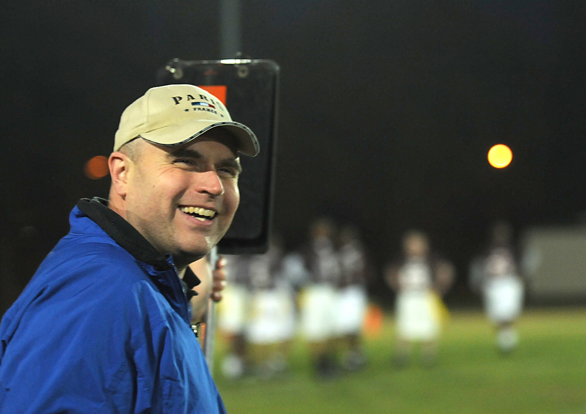 U.S. Air Force Lt. Col. Steve Sweeney, 86th Communications Squadron commander, cheers on Team Comm during the Army versus Air Force flag football game, Vogelweh Military Complex, Germany, Oct. 21, 2009. The Air Force team beat the Army, represented by Team Landstuhl Regional Medical Center, with a final score of 12-7. (U.S. Air Force photo by Tech. Sgt. Sean White)