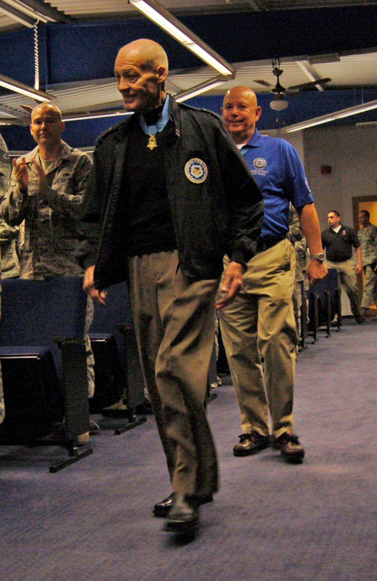 Retired U.S. Army Col. Robert Howard (front) and Command Sgt Maj. Gary Littrell, Medal of Honor recipients, walk to the front of the Kisling Noncommissioned Officer Academy on Kapaun Air Station, Germany, Oct. 23, 2009. The recipients visited the academy as part of an Armed Forces Entertainment tour where they shared stories and experiences with the NCOs. (U.S. Air Force photo by Senior Airman Amanda Dick)