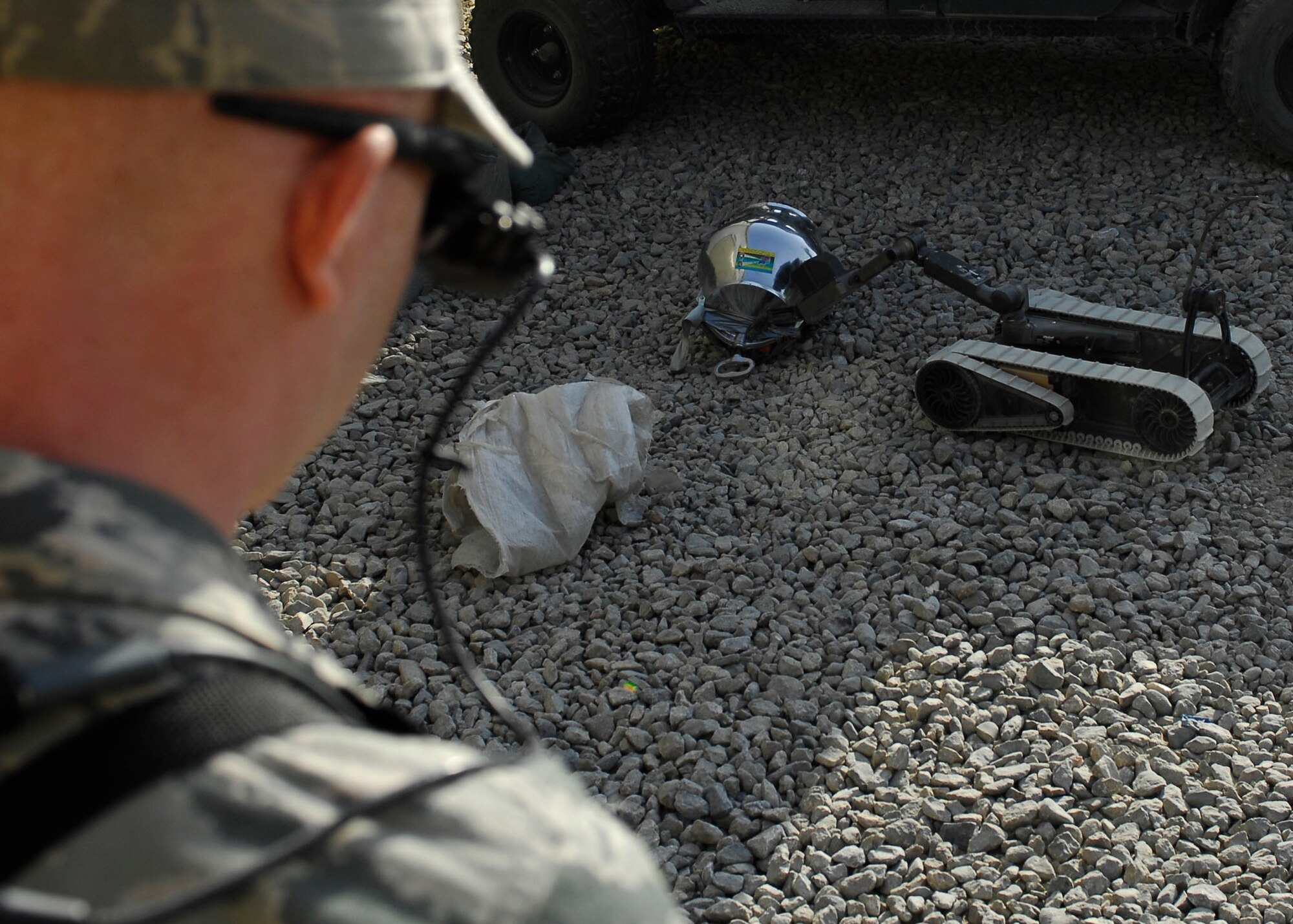 BAGRAM AIRFIELD, Afghanistan -- Senior Airman James Dobrynski, an explosives ordnance disposal technician, maneuvers a robot to disarm a mock Improvised Explosive Device during training Oct. 26, 2009.  The robots can be used during missions to move or disarm IEDs and look for additional IEDs.  Airman Dobrynski is a Joint Expeditionary Tasked Airman from the 755th Air Expeditionary Group, 755th EOD Alpha Flight, attached to the 741st EOD Battalion.  Airman Dobrynski is deployed from Luke Air Force Base, Ariz., and hails from St. Louis, Mo.  (U.S. Air Force photo/Senior Airman Felicia Juenke)